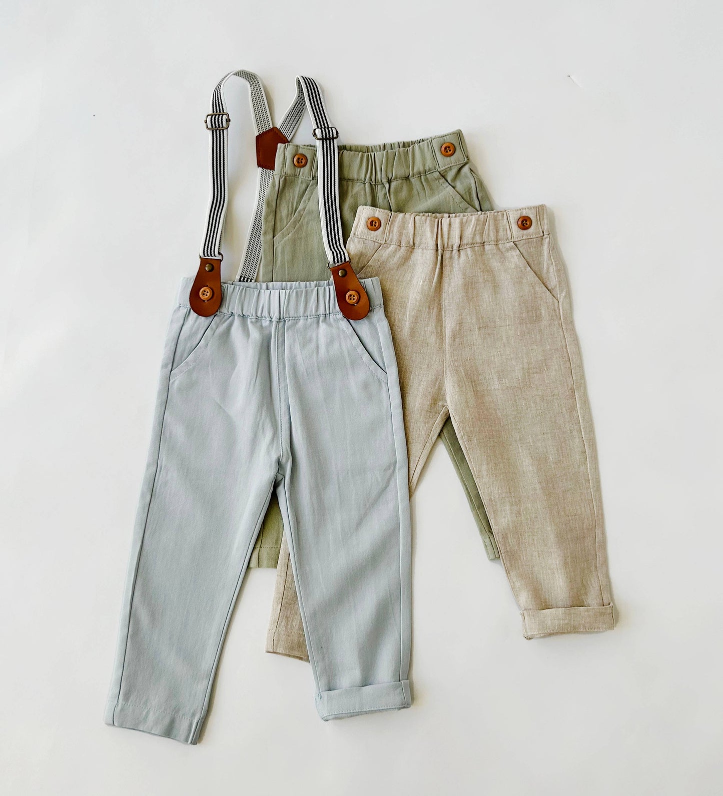 Baby linen suspender pants close up strap and button detail