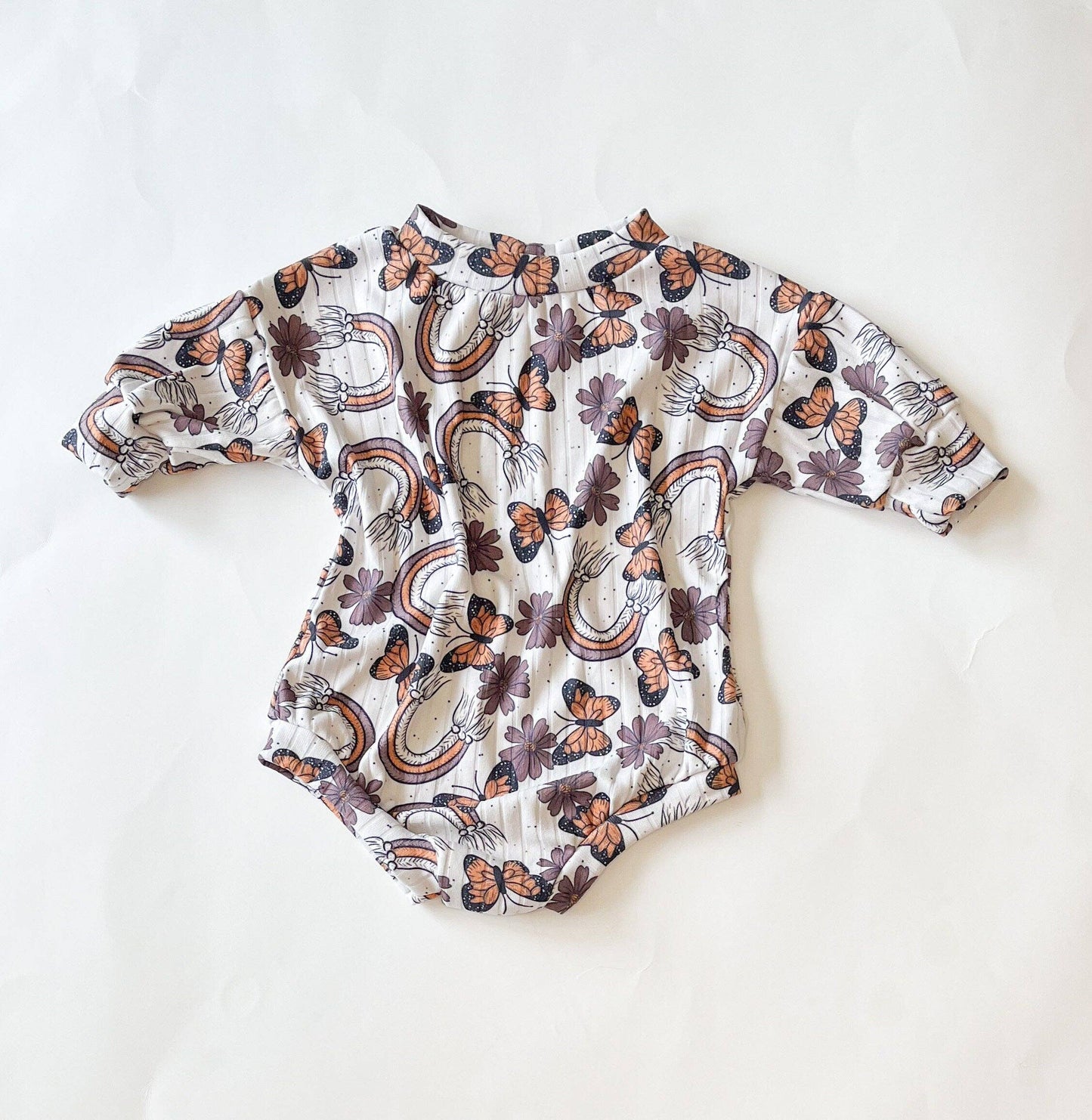 Rainbows and butterflies sweater romper for baby girls soft knit front view