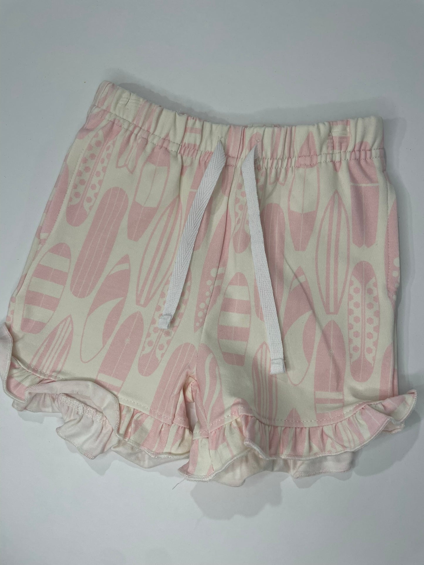 Surf's Up girls ruffle top and shorts flat lay product view