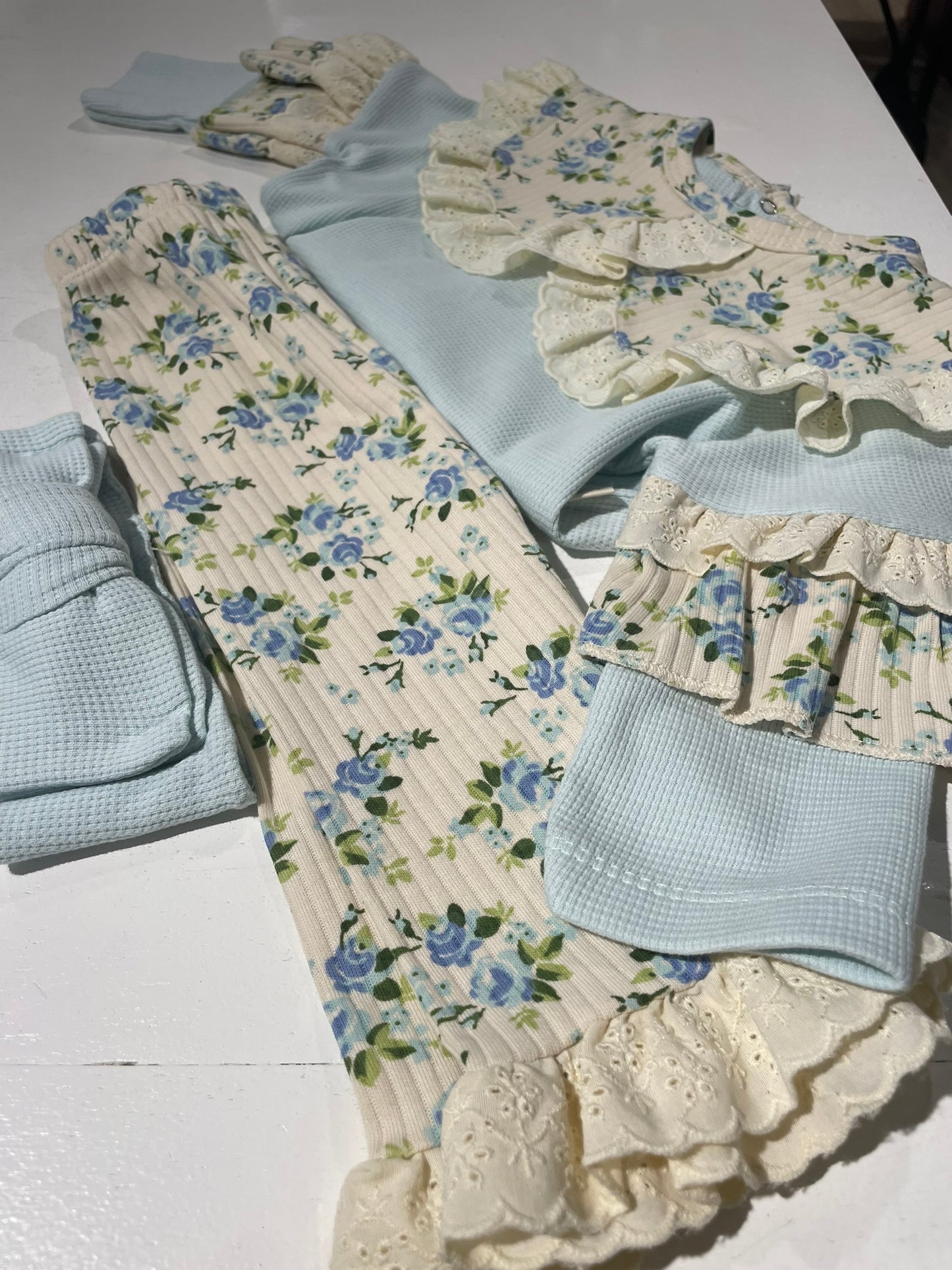 3 piece floral baby gift set flat lay all items view