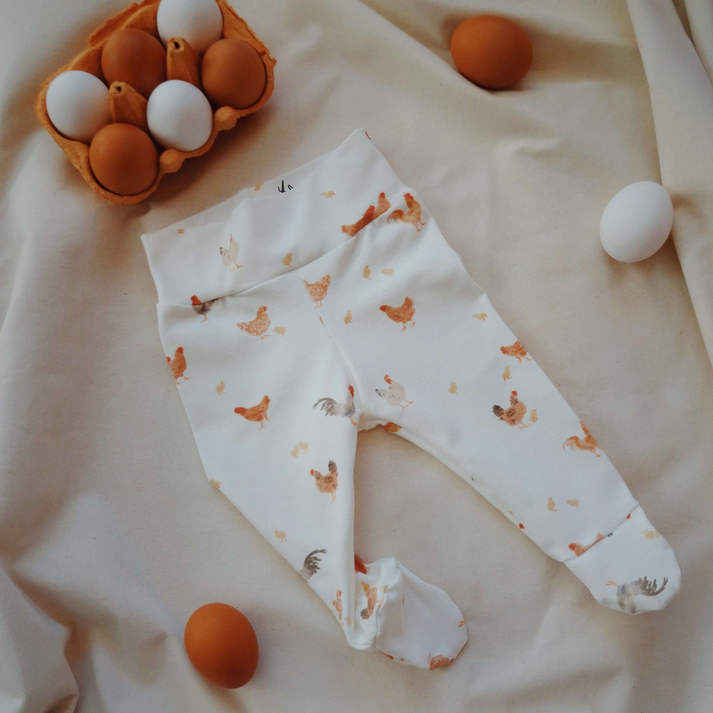 Chicken footed leggings for baby flat lay product view
