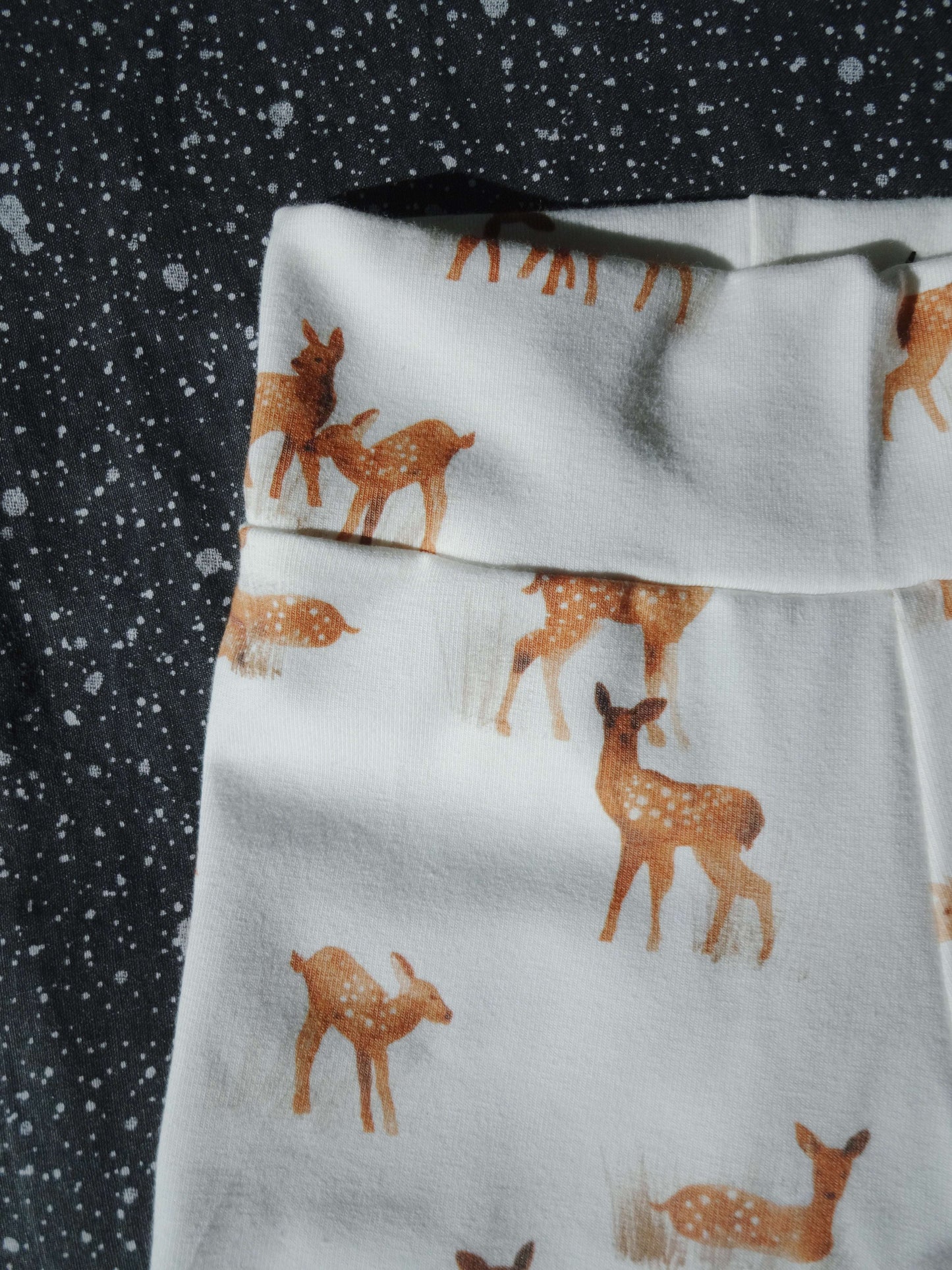 Fawn footed baby leggings close up foot and print detail
