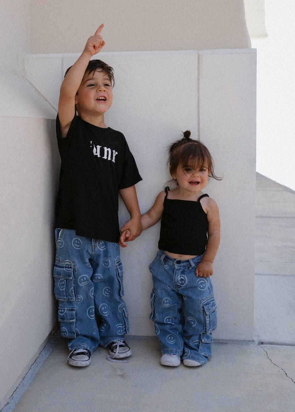 Relaxed fit smiley face kids jeans with elastic waistband flat lay product view