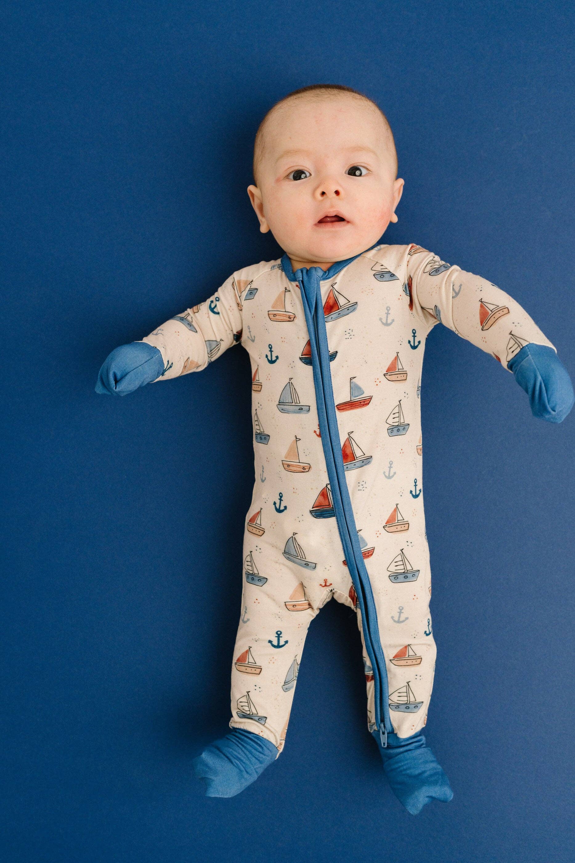 Chemical free bamboo baby sleeper with fold over mittens flat lay product view