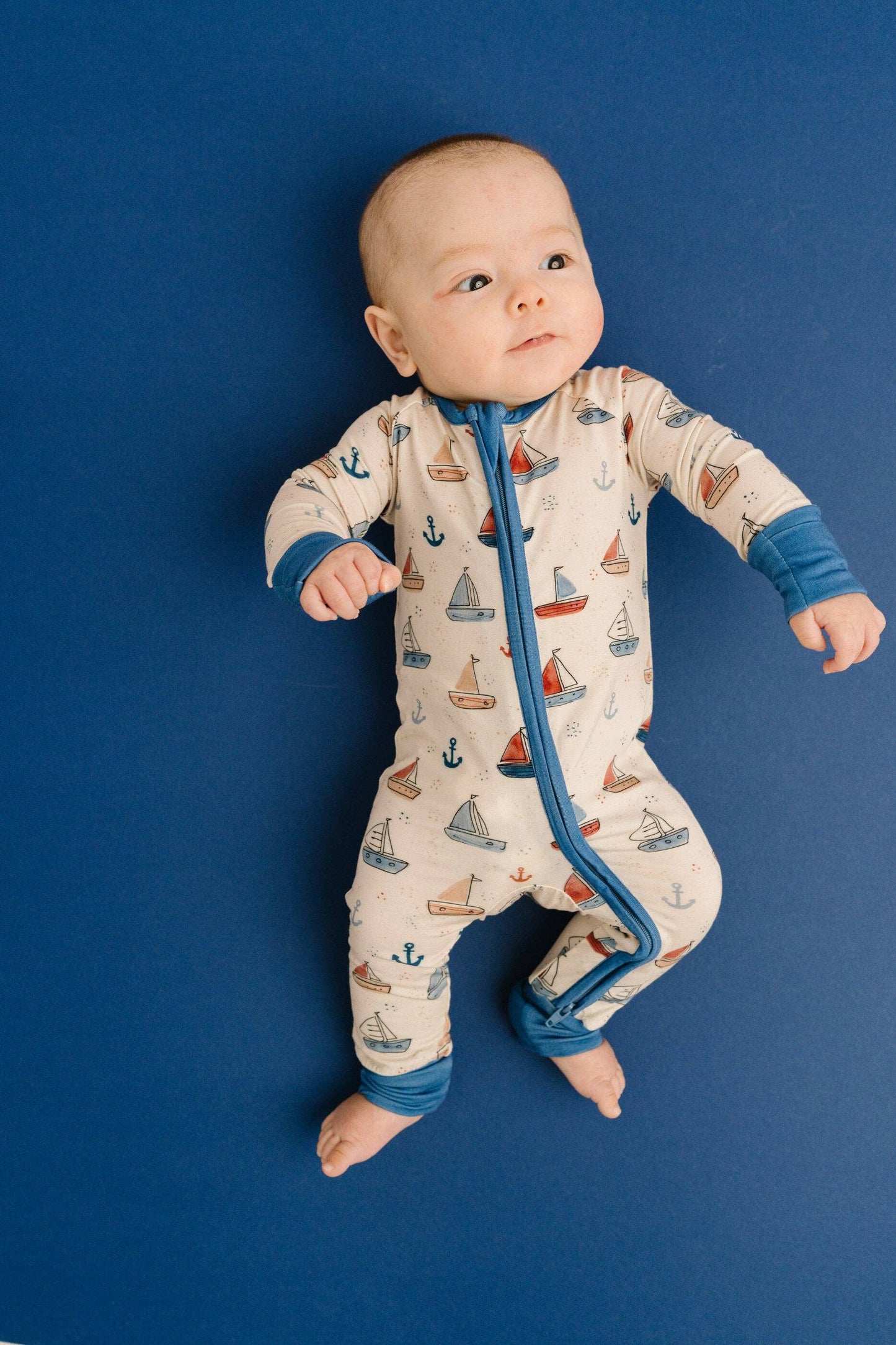 Nautical sail bamboo infant sleeper close up zipper and mitten cuff detail