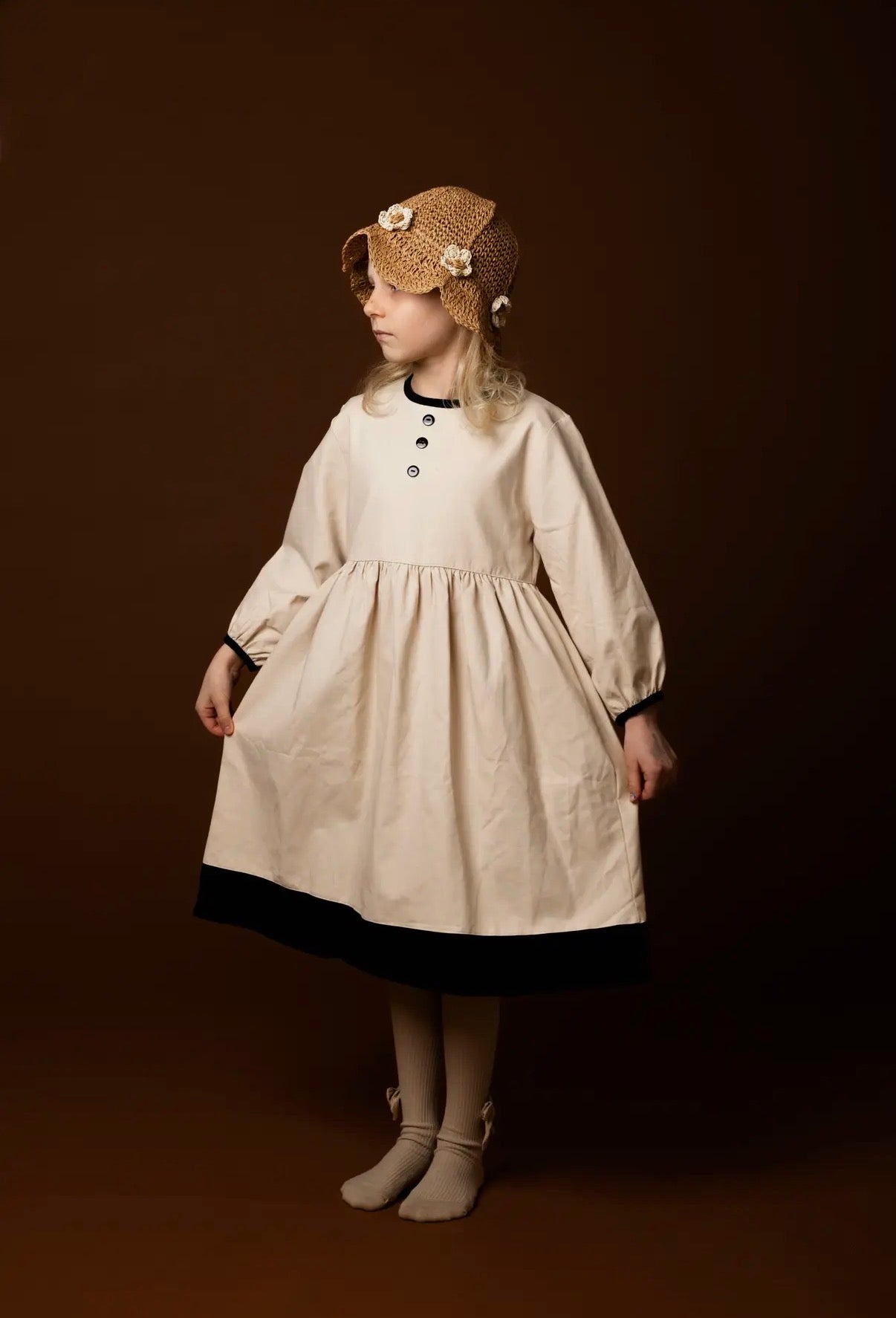 Baby vanilla bean linen dress worn lifestyle view