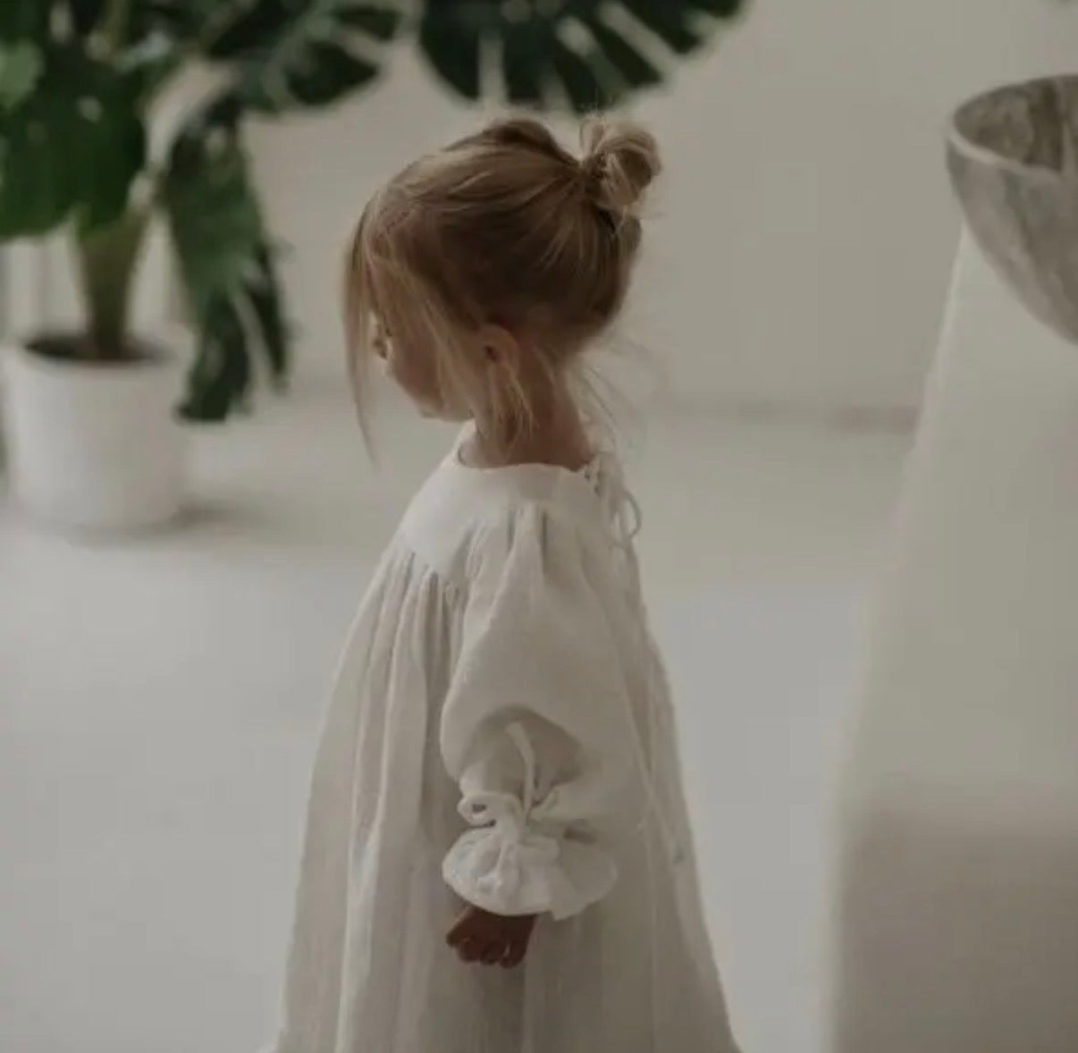 Girls flowing organic muslin dress back view