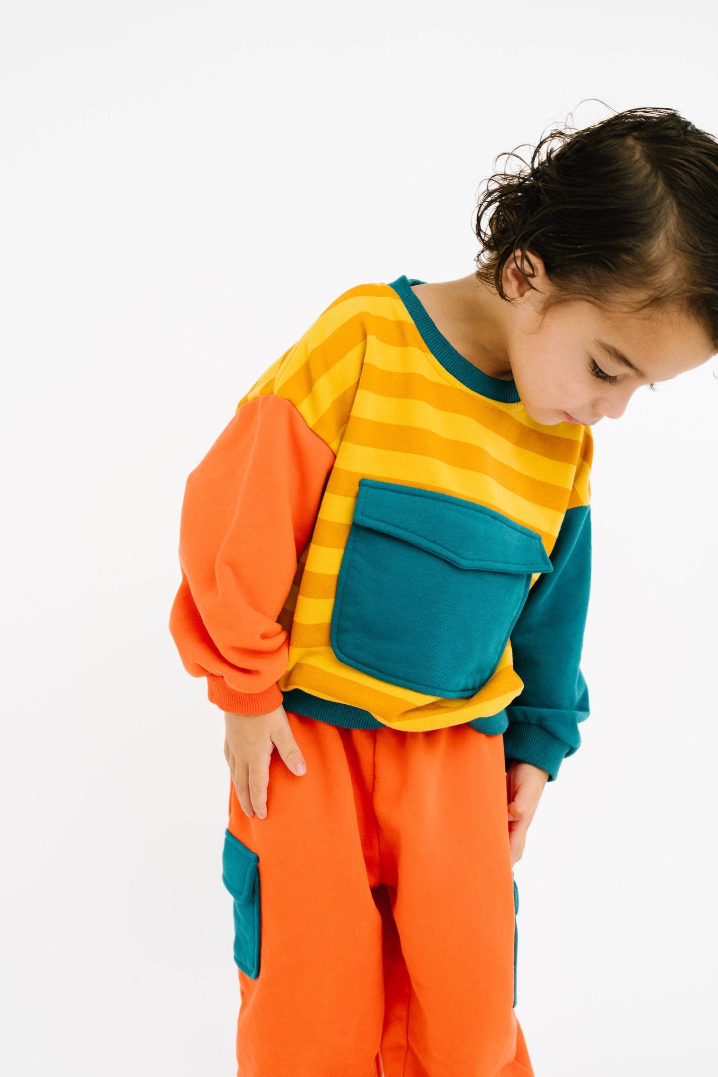 Girls colorful retro matching sweatshirt and pants close up styling view