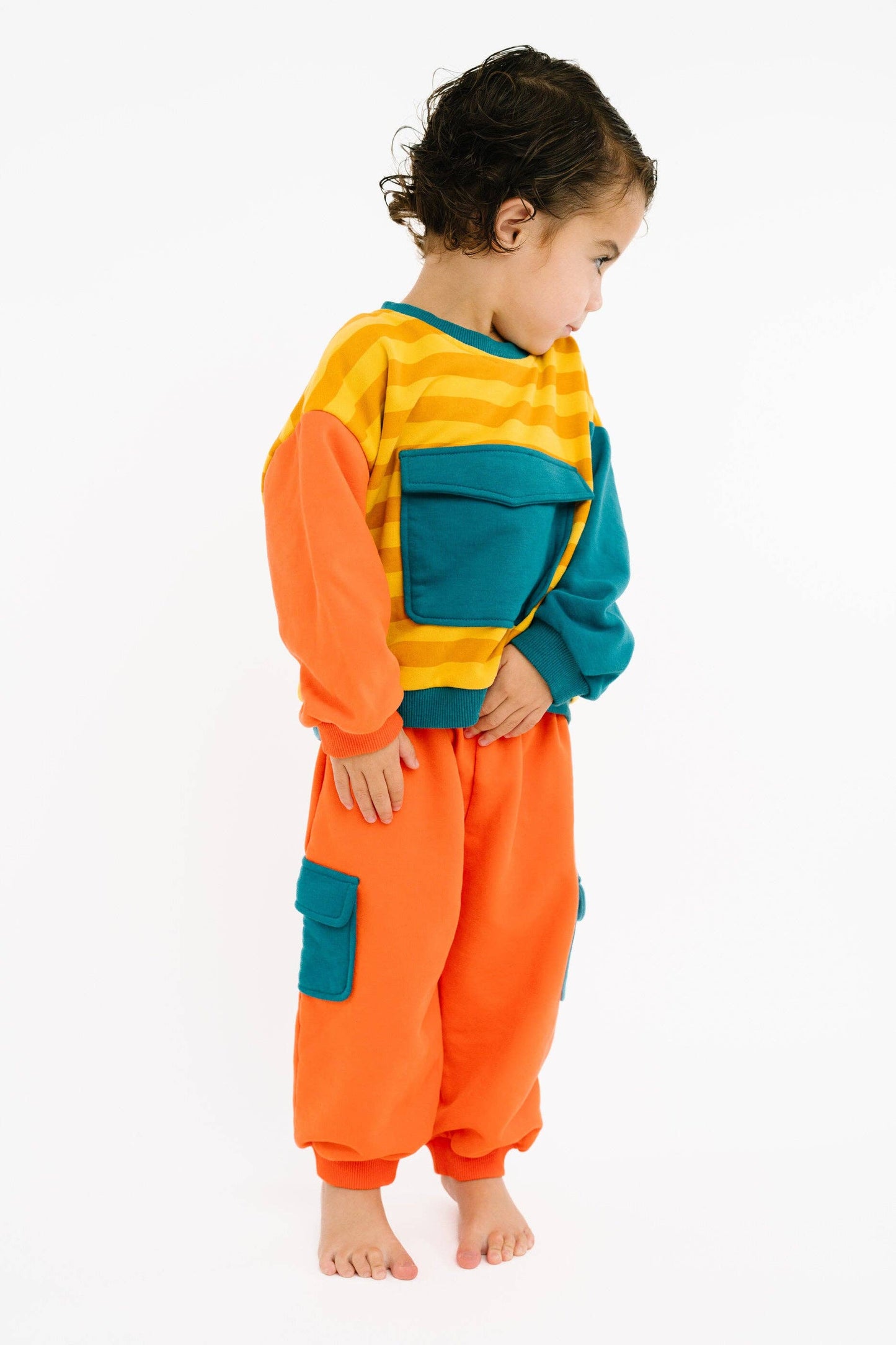 Bright retro kids sweatsuit worn full outfit view with colorful tones