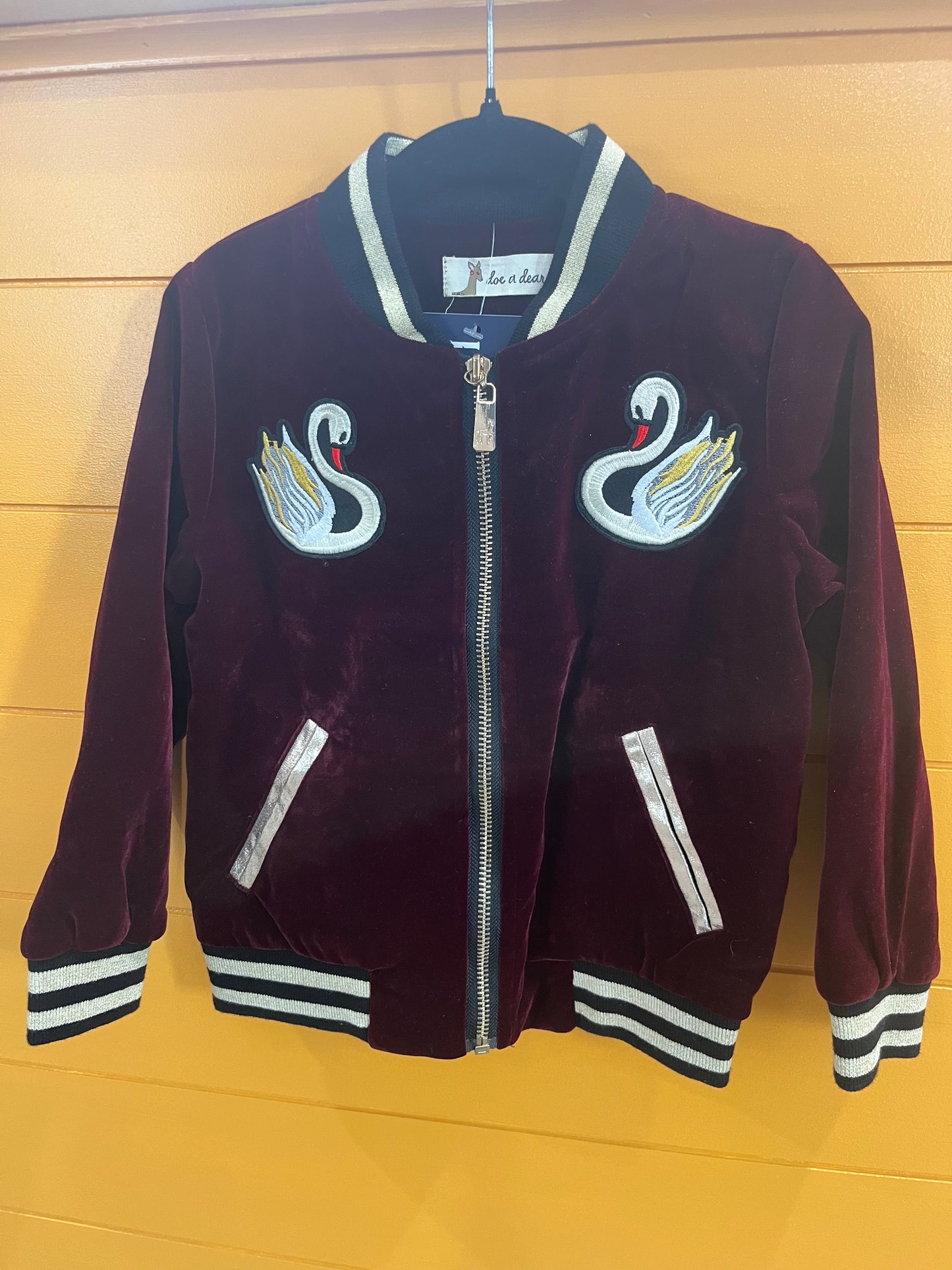 Girls velvet swan jacket worn lifestyle view