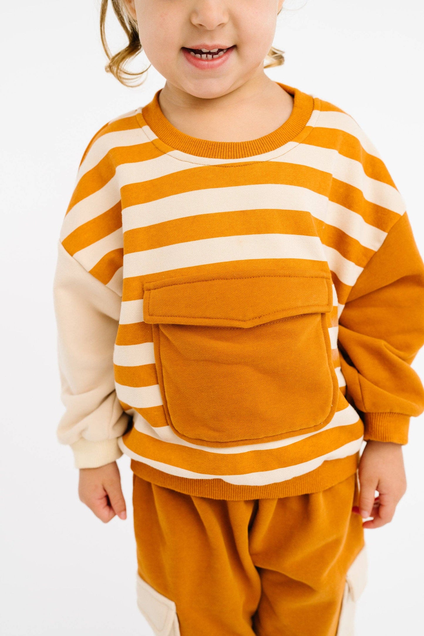 Girls earthy cinnamon retro sweatsuit oversized fit worn close up view