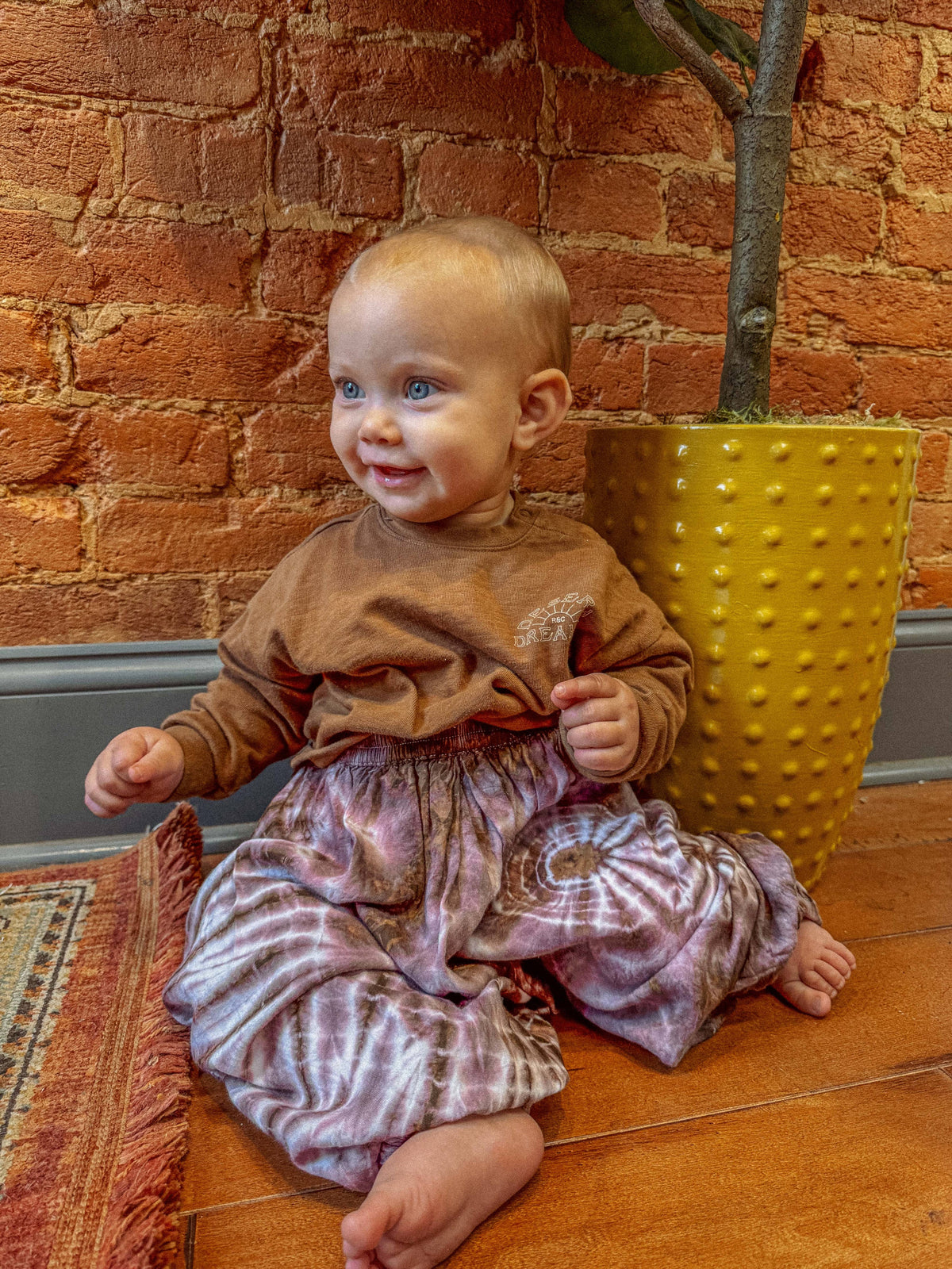 Kids lil hippie pants in fun print worn lifestyle shot