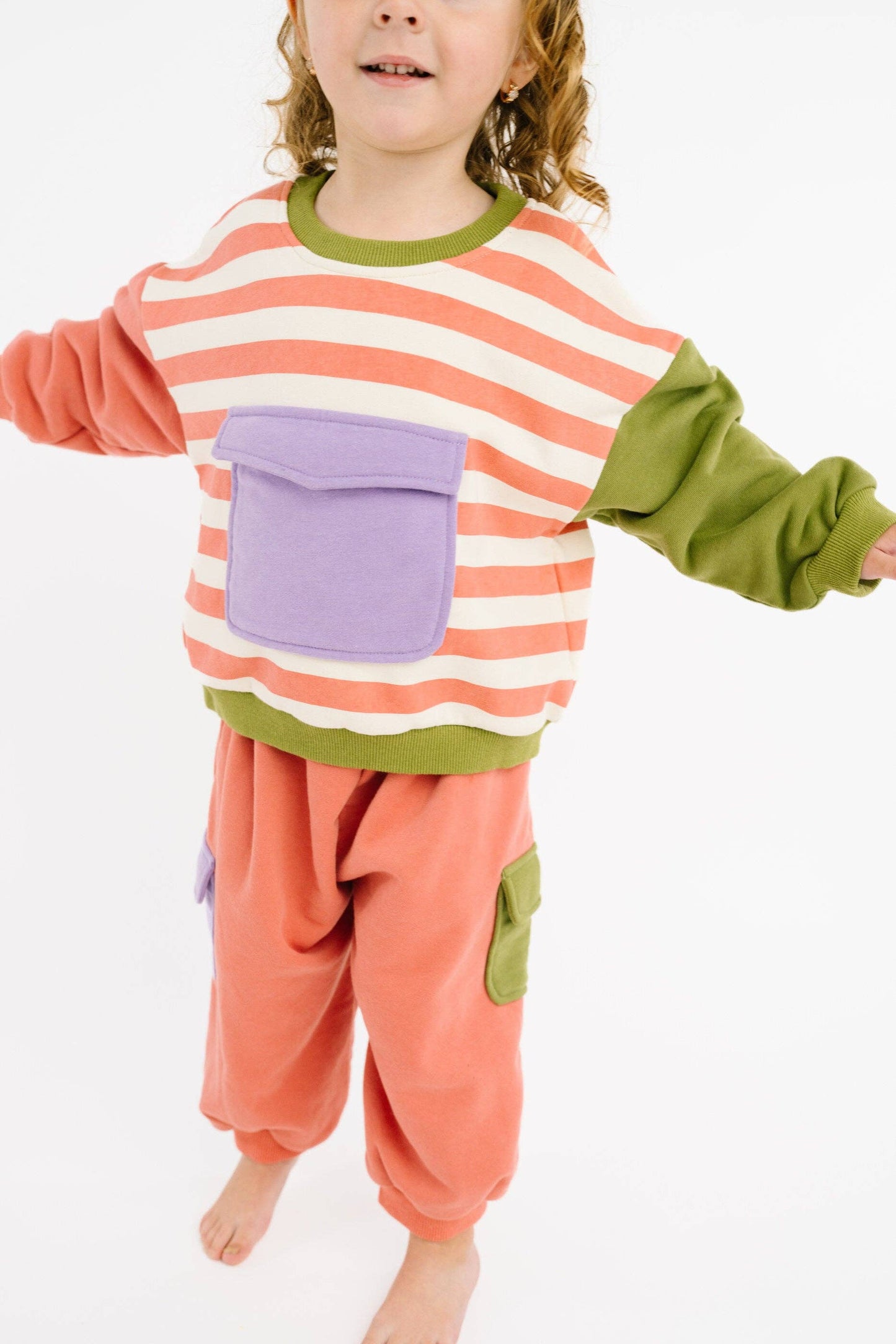 Girls pastel retro sweatsuit lifestyle shot for playdates and lounging