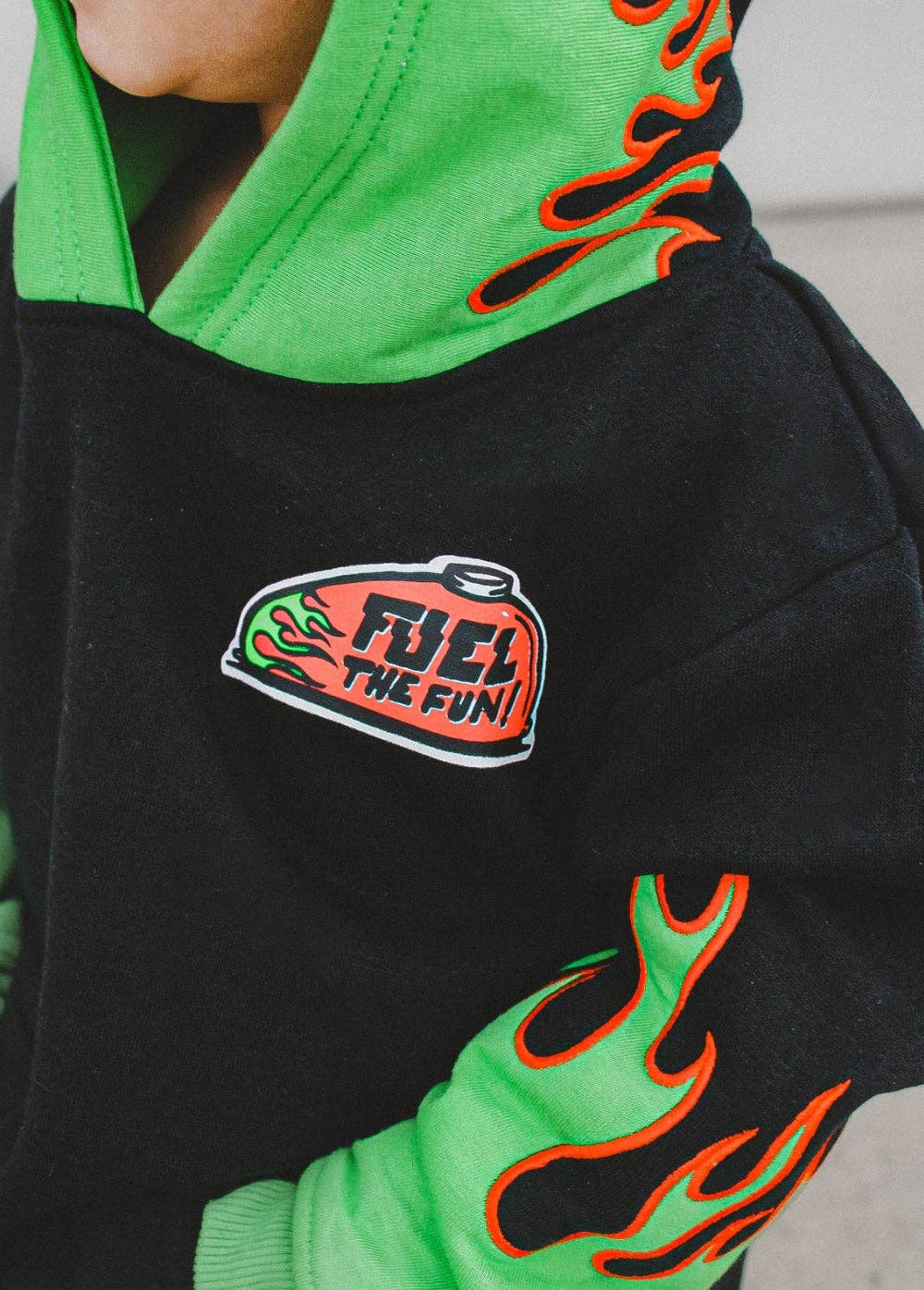 Boys green flame organic cotton hoodie close up of embroidered hood detail