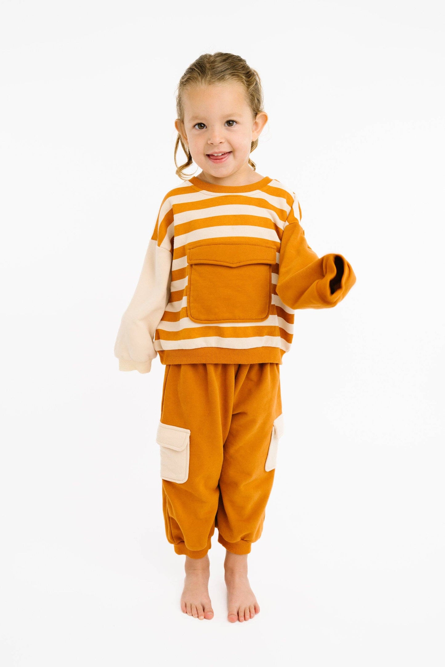 Cinnamon retro toddler matching set flat lay product view in warm tones