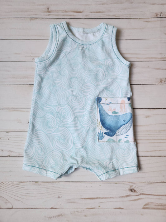 Wave tank romper for babies in teal wave print with whale pocket front view