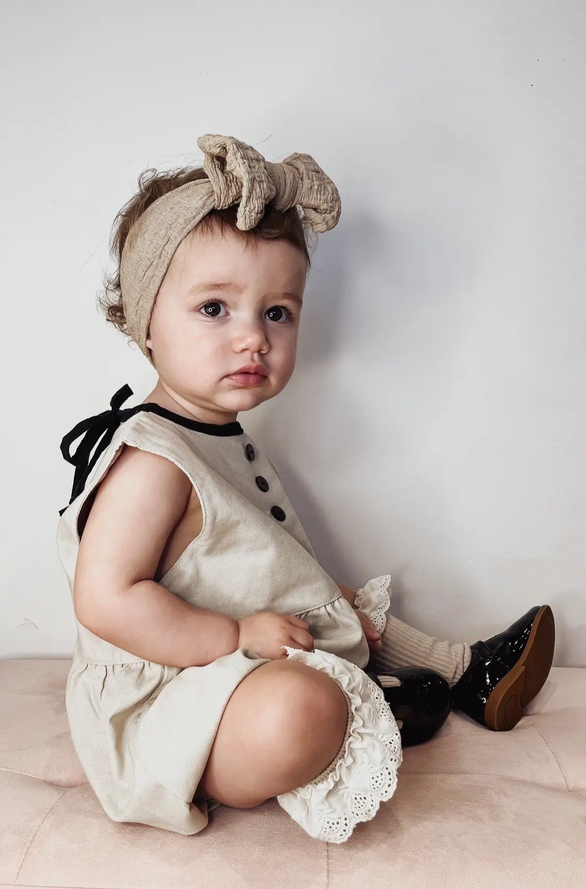 Linen baby romper side view detail