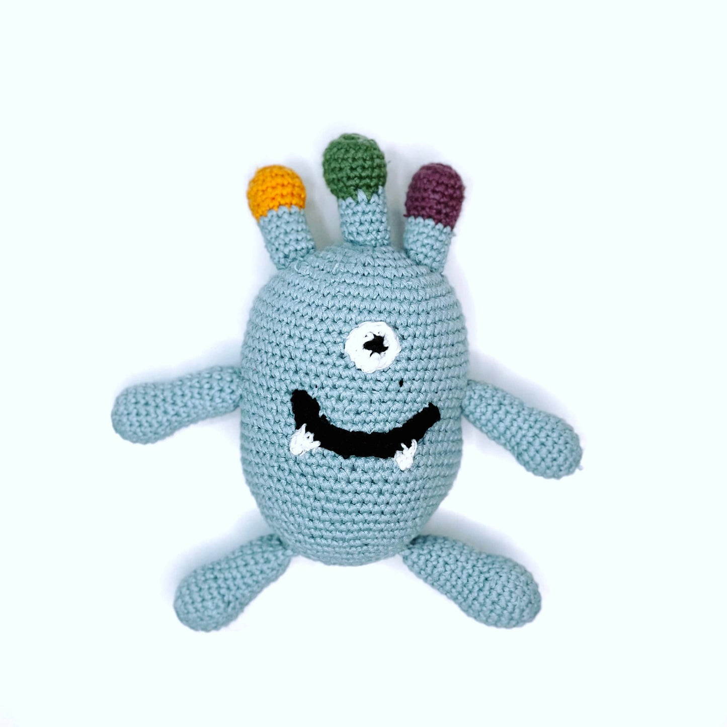 Organic cotton monster rattle close up face and fabric detail