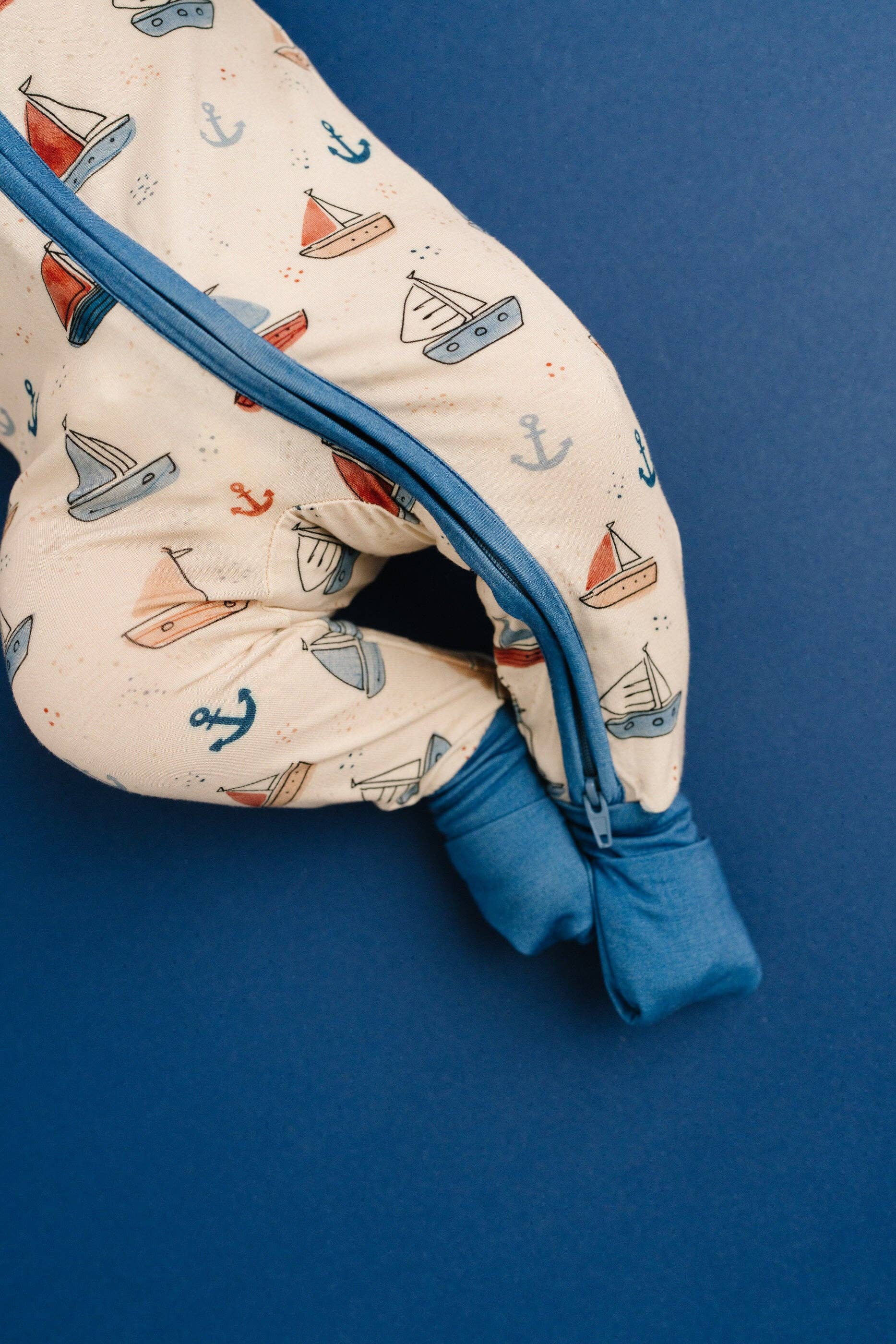 Infant bamboo zip sleeper in nautical print with 2-way zipper detail view