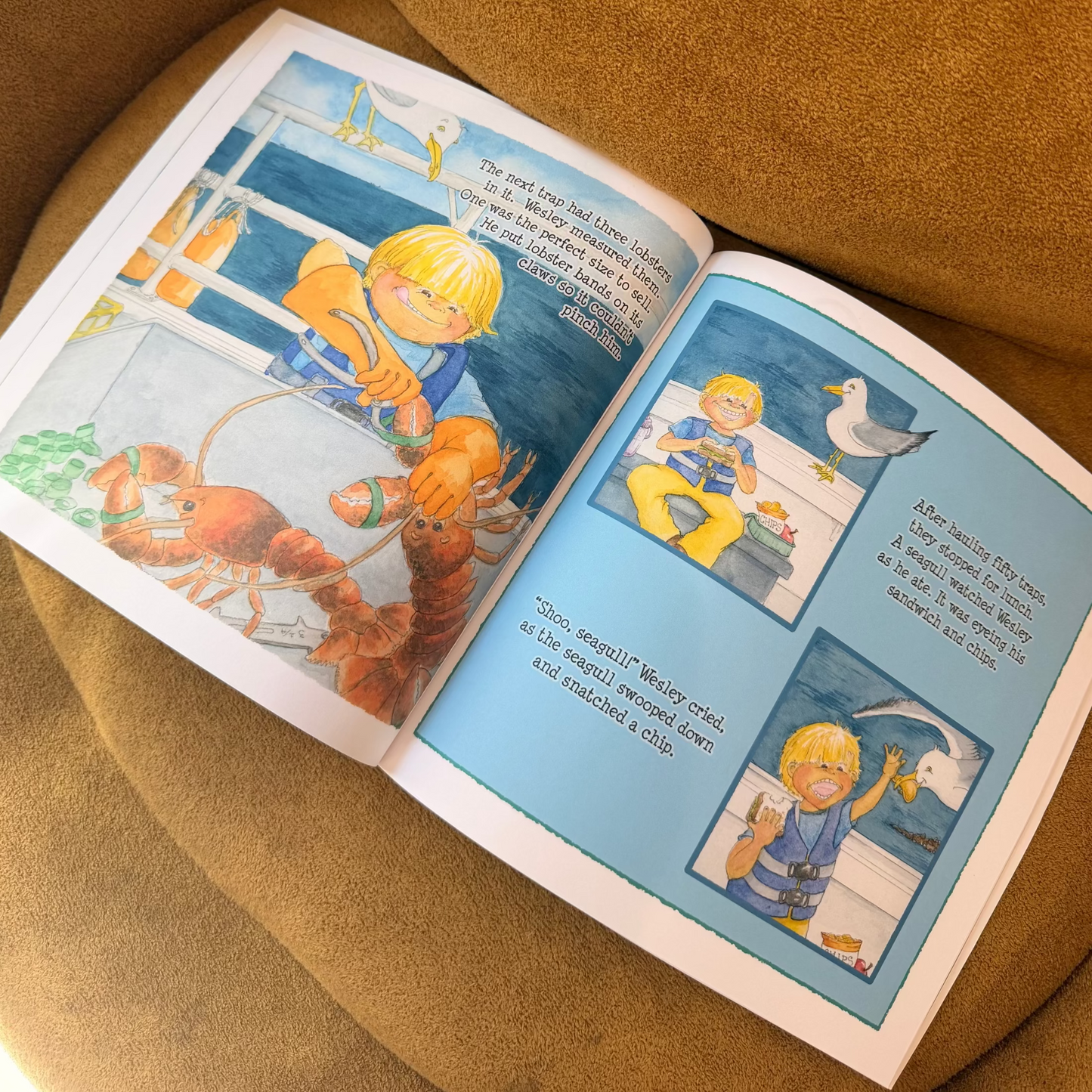 Open children's book on a brown cushion