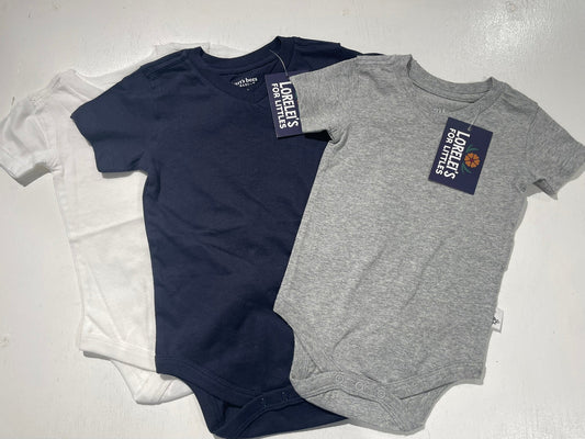 Two baby onesies, one navy and one gray, with labels on a white background.