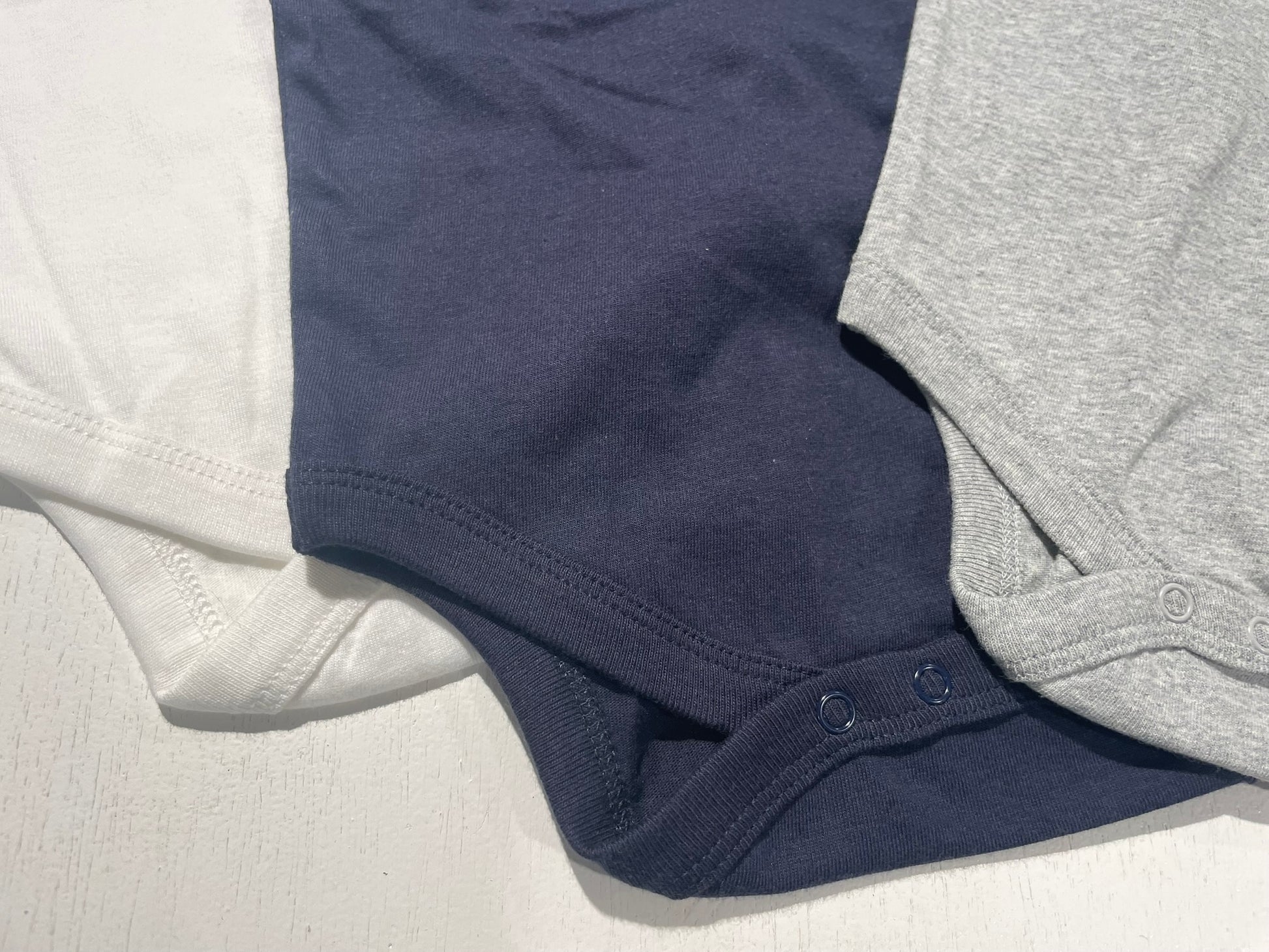 Organic cotton v-neck bodysuit for babies worn lifestyle view