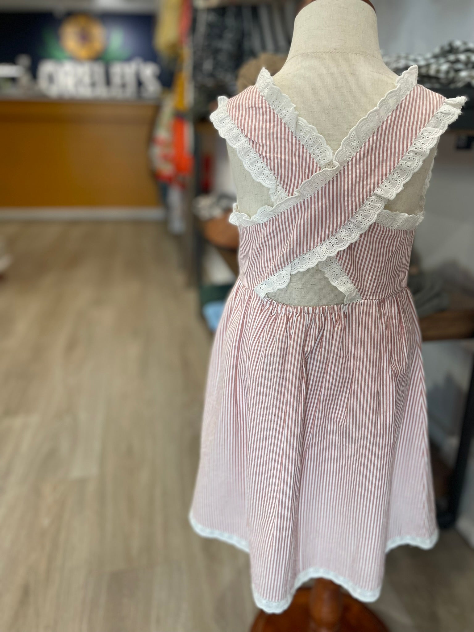 Organic criss-cross toddler dress close up back tie detail