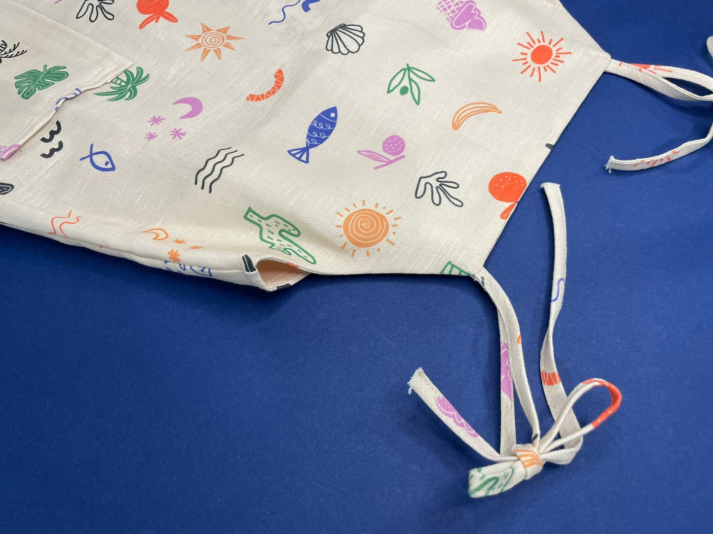 Girls safari linen dress side view detail