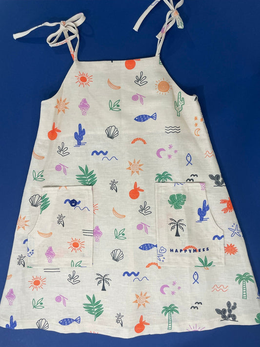 Fabric with colorful beach-themed patterns on a blue background
