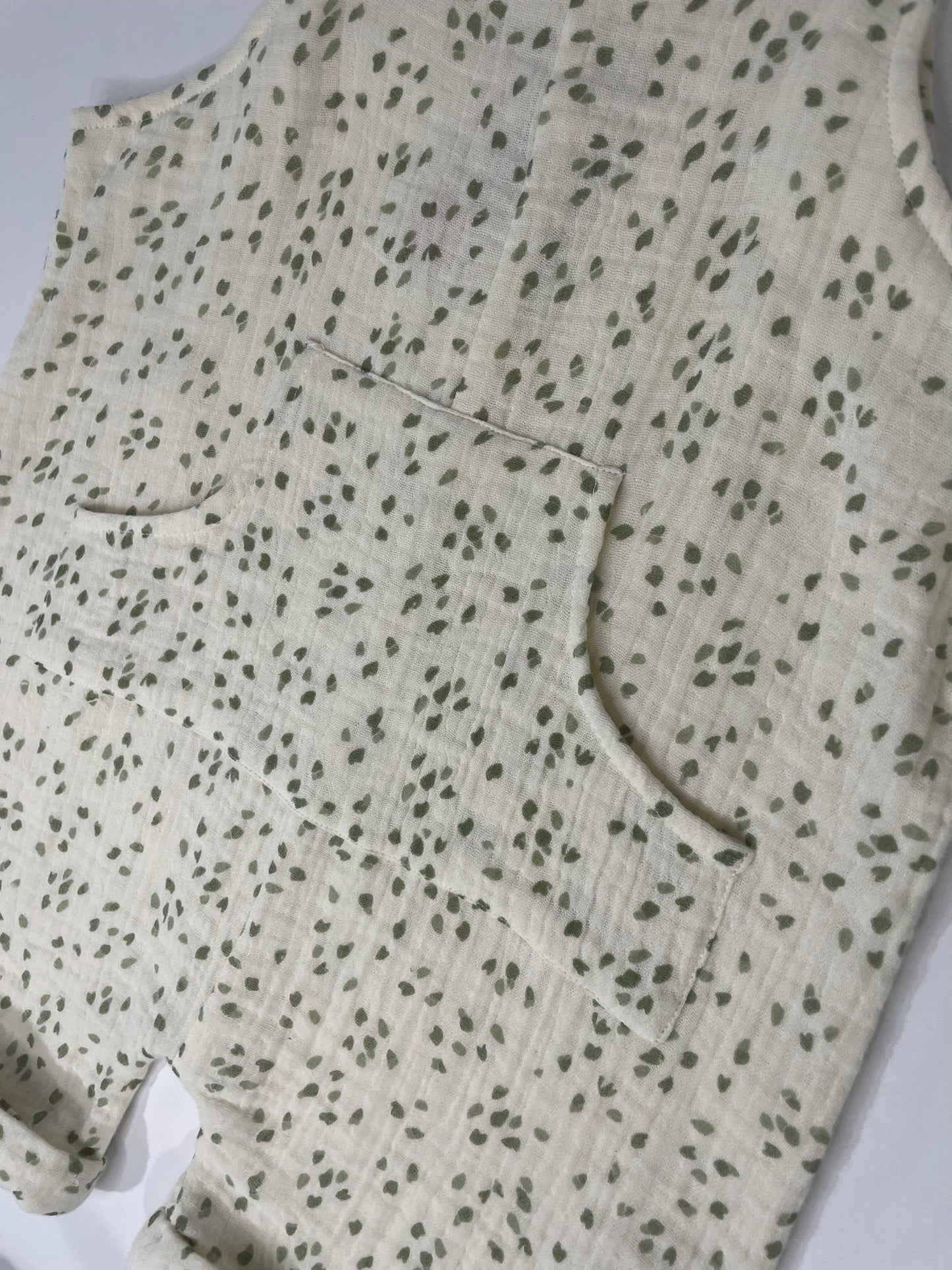 Organic petal shortalls close up petal print and strap detail