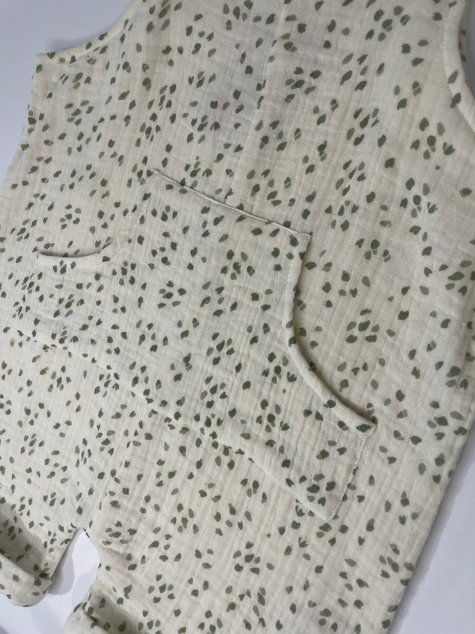 Organic petal shortalls close up petal print and strap detail