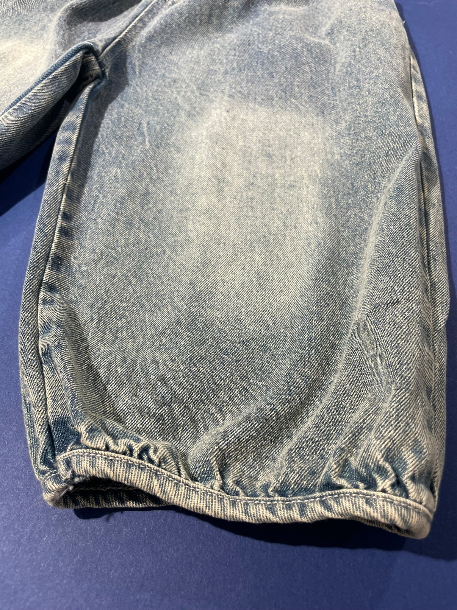 Kids denim jogger pants flat lay product view