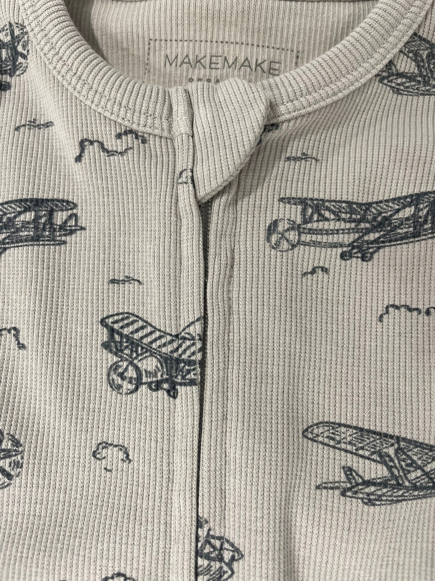 Ready for Take Off romper close up airplane print and snap detail