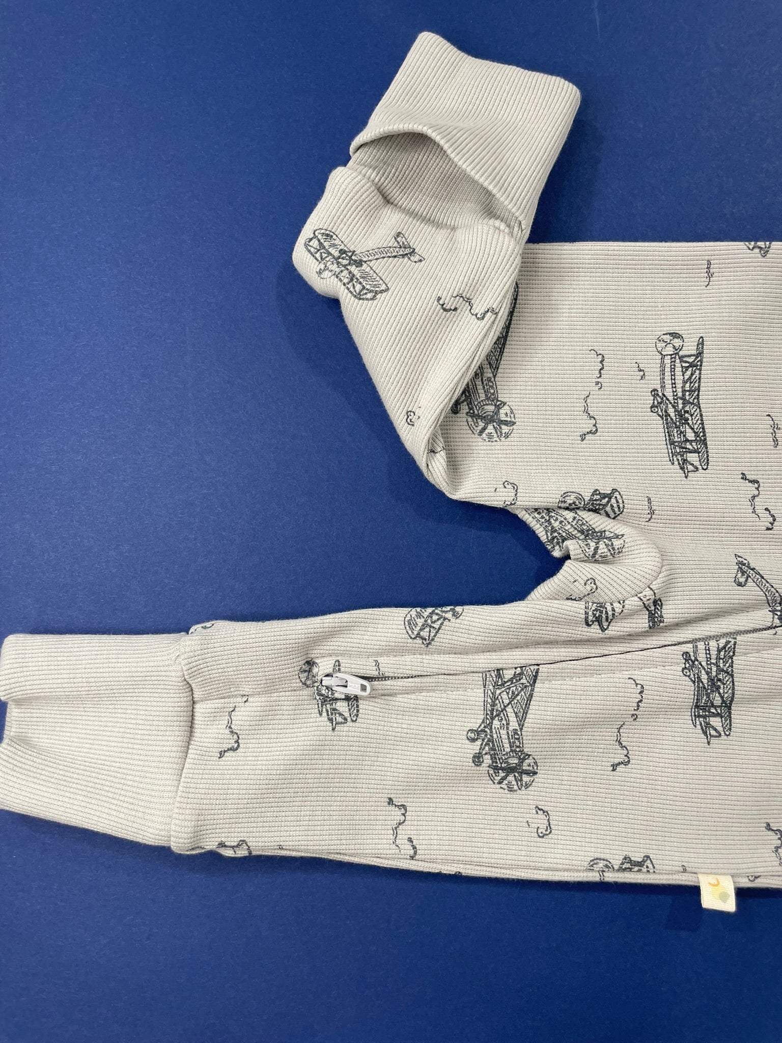 Baby in Ready for Take Off romper indoor cozy view