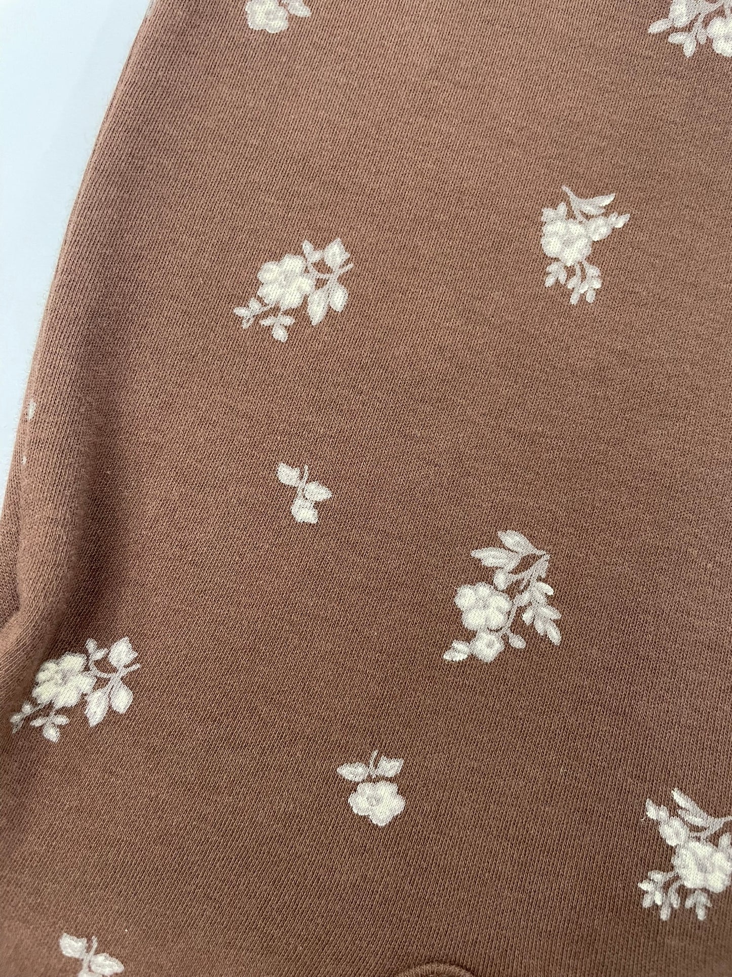 Organic ruffle sleeve romper fabric close up view