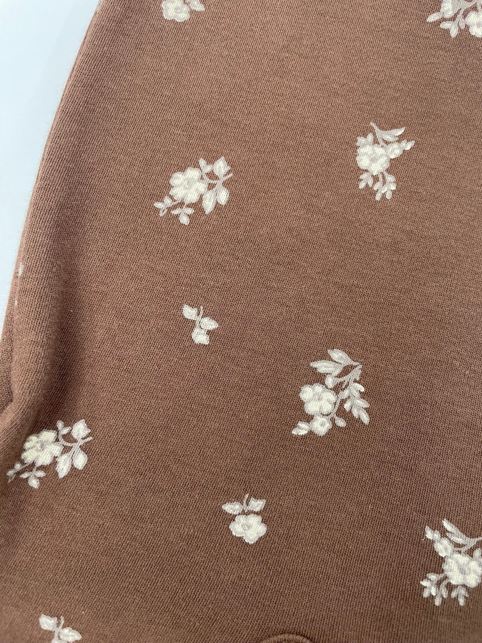 Organic ruffle sleeve romper fabric close up view