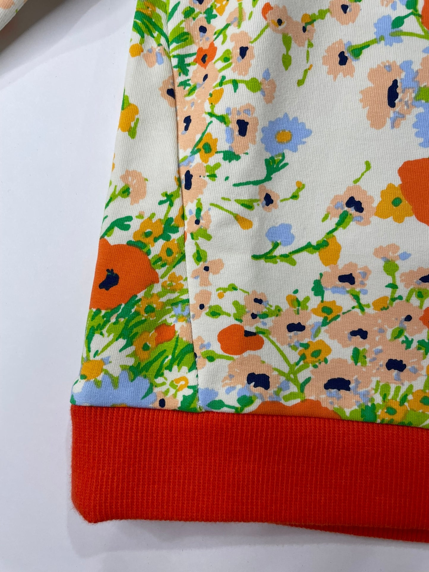 Kids in poppy floral pullover outdoor view