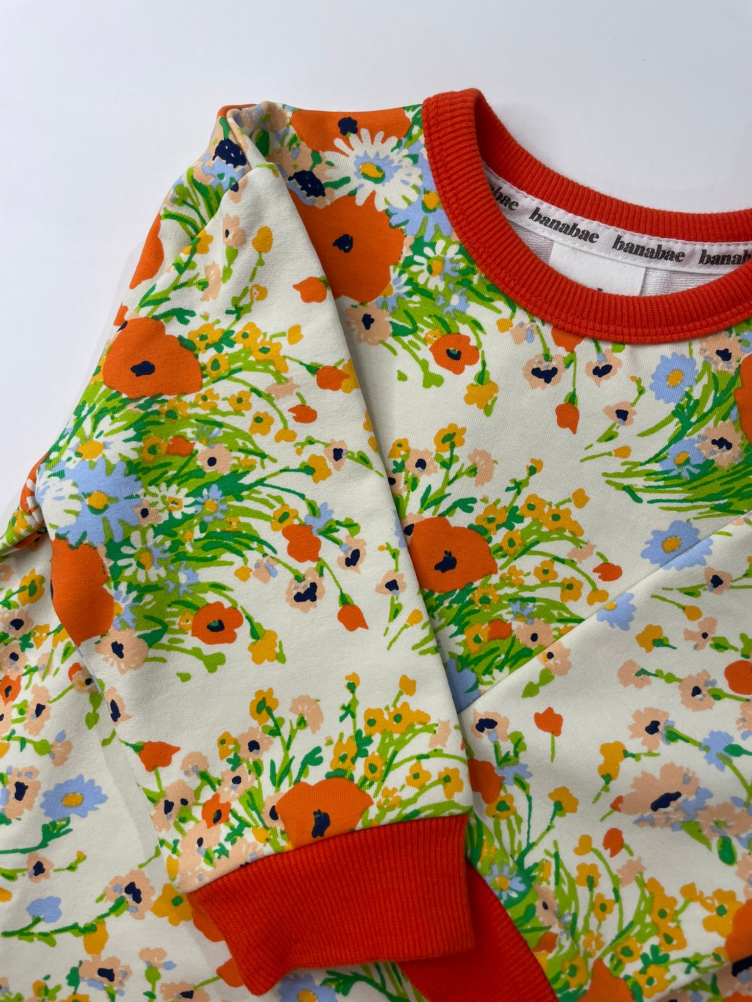 Poppy floral organic pullover side view detail