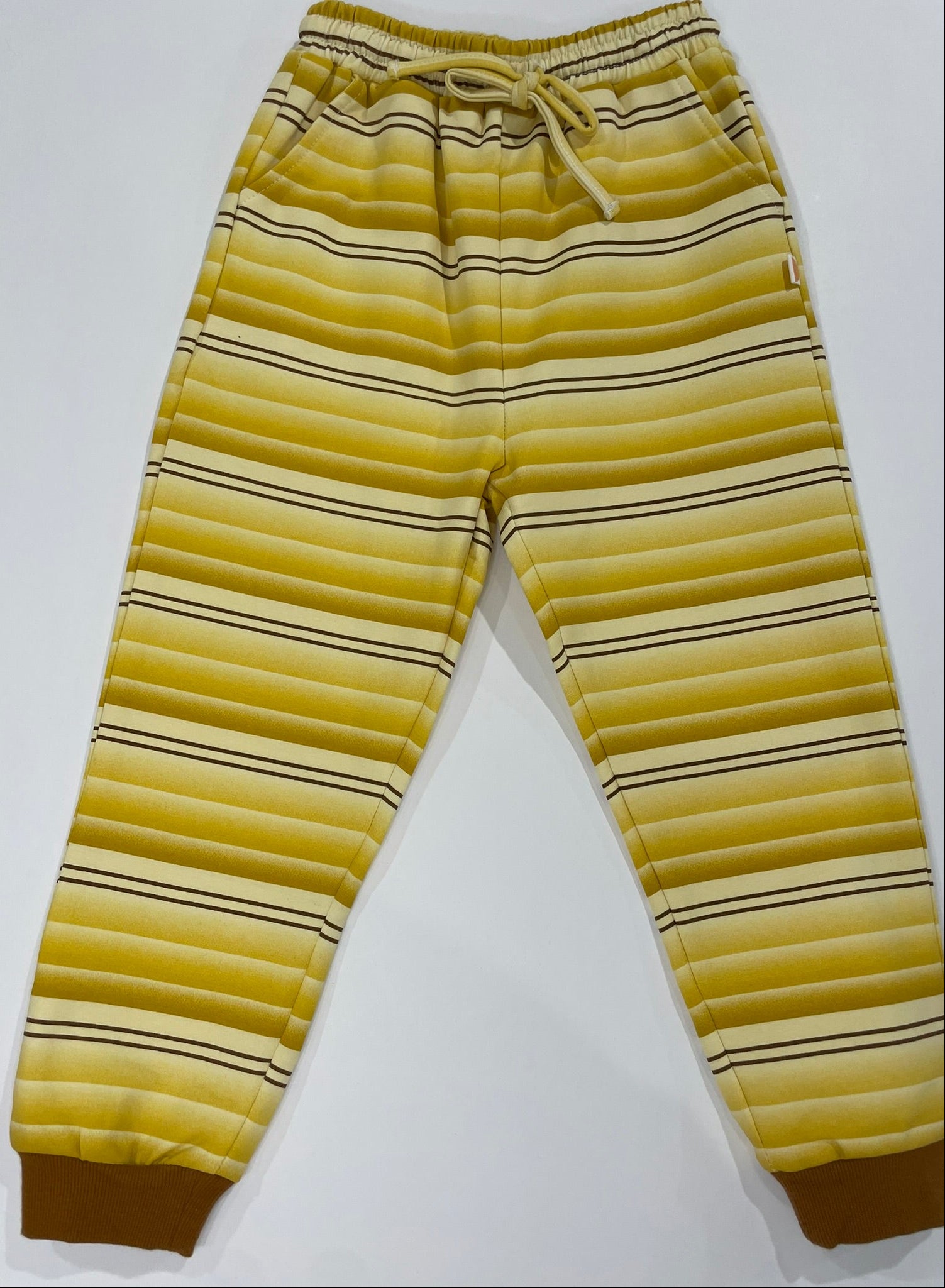 Yellow striped pants on a white background