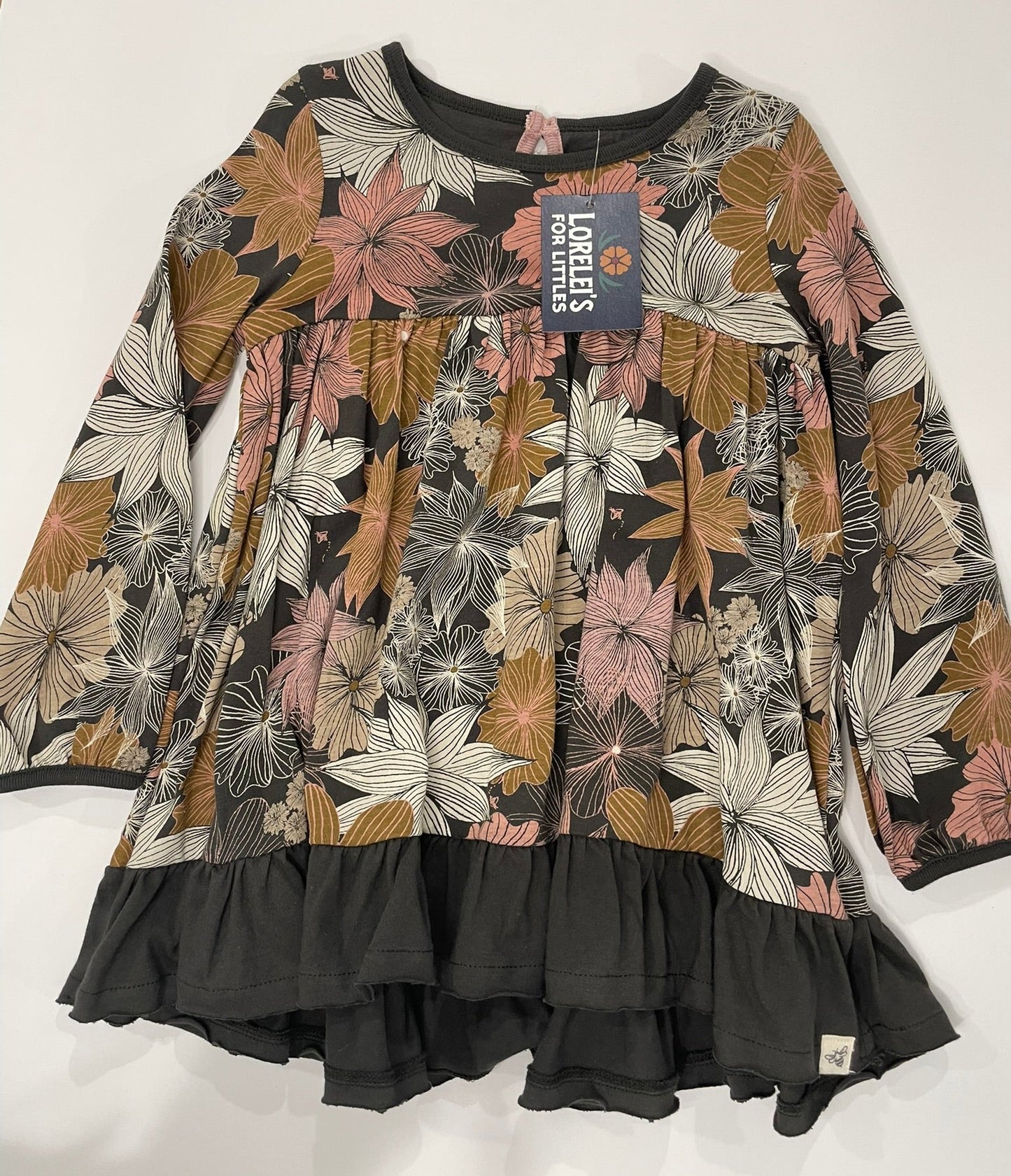 Floral-patterned shirt with a brand label on a white background