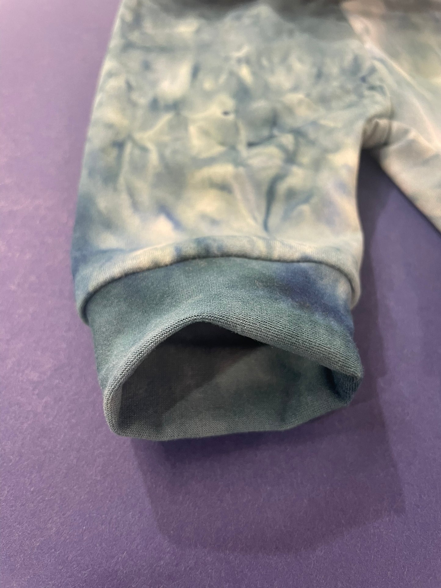Handmade teal tie-dye kids jogger pants worn lifestyle view
