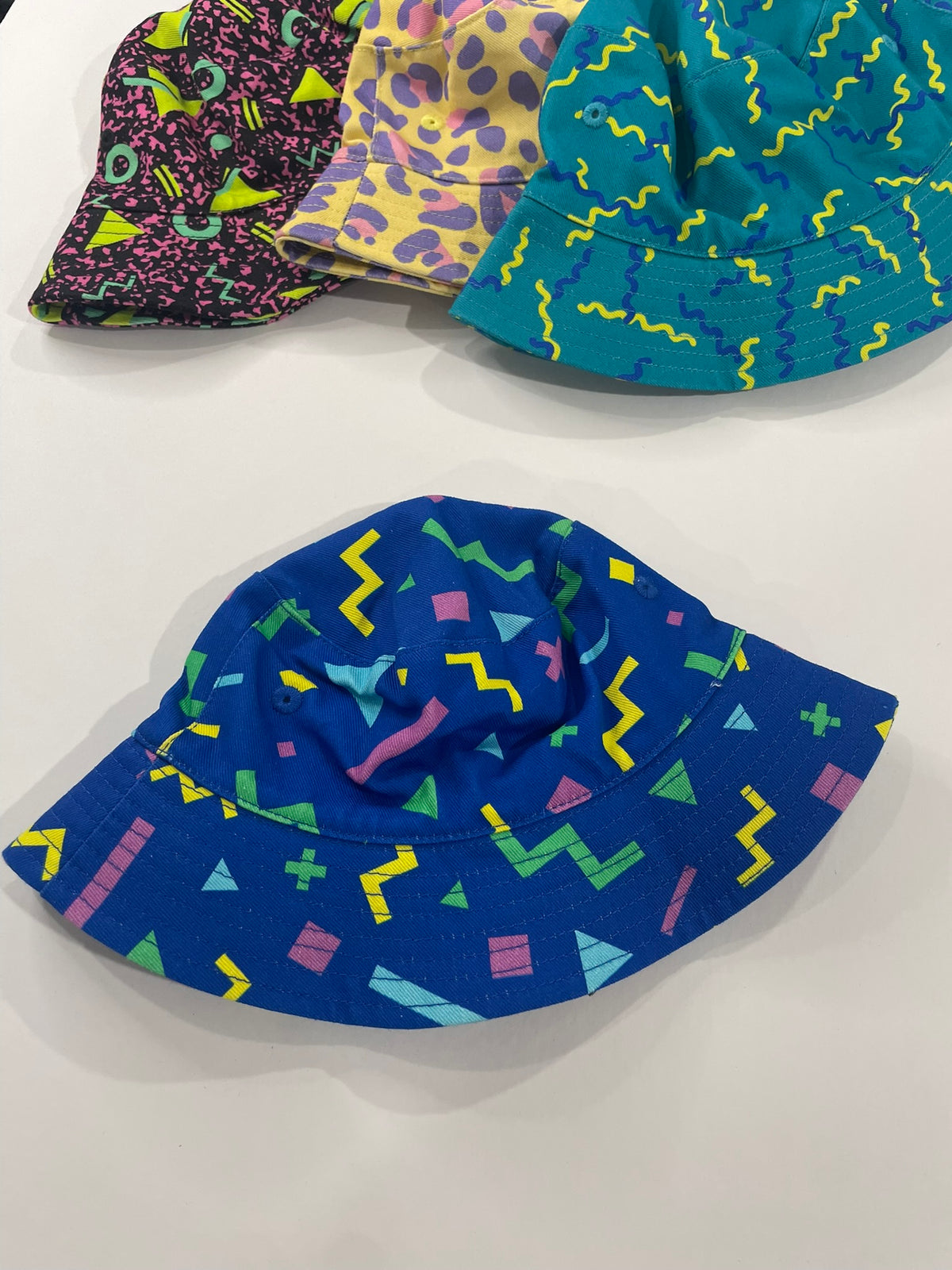Blue 90s print bucket hat for kids worn lifestyle view