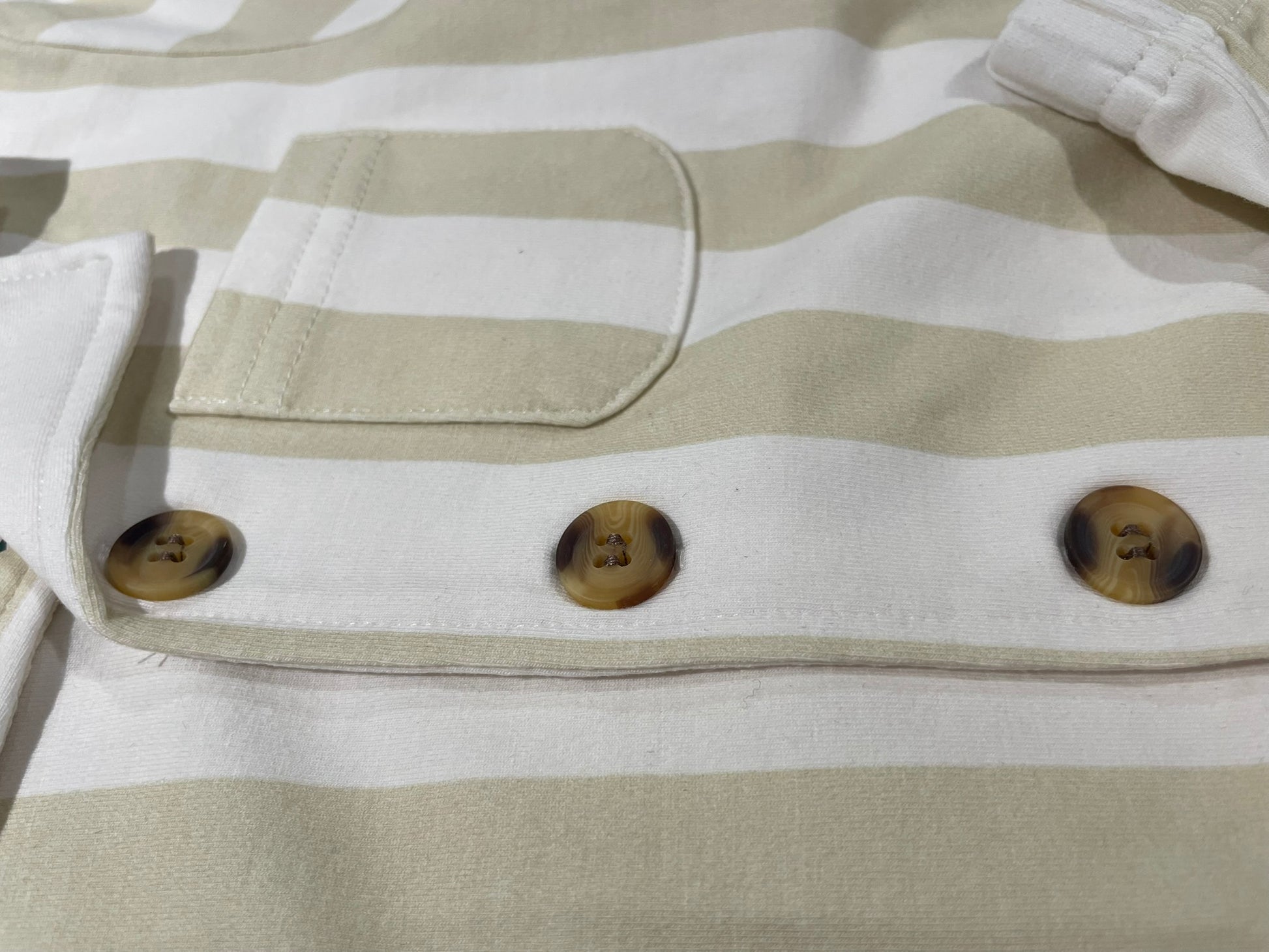 Beach Lines tan polo set close up fabric and collar detail
