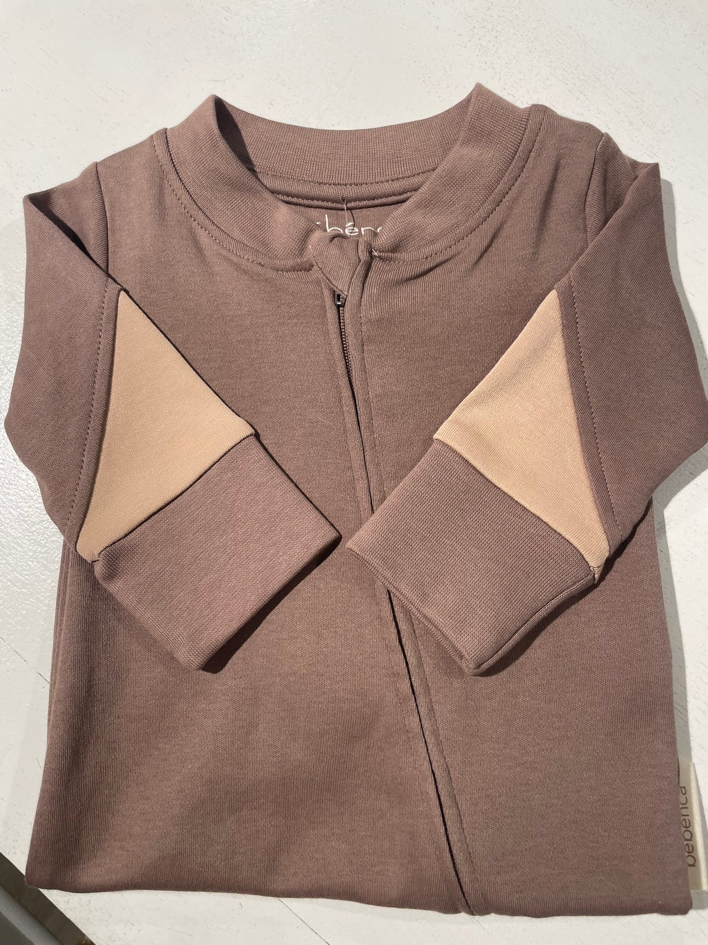 Color block organic baby romper flat lay product view
