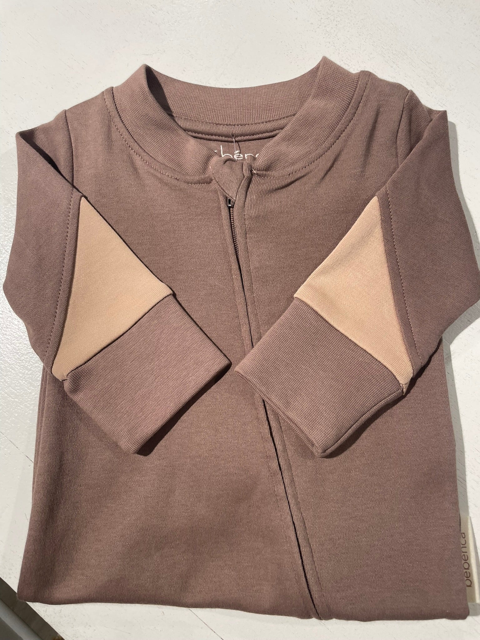Color block organic baby romper flat lay product view