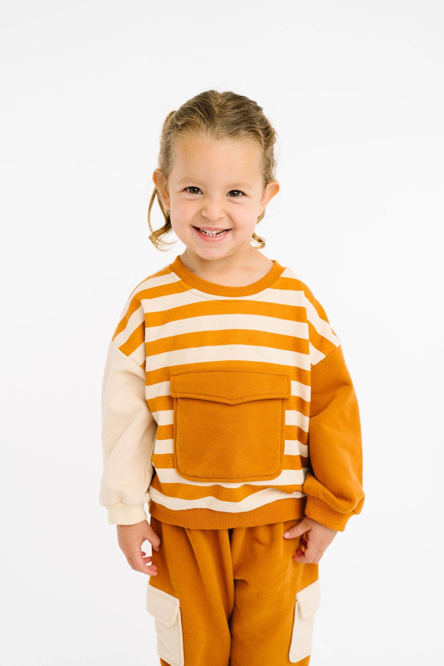Cinnamon retro kids boutique sweatsuit worn full outfit earthy tones view