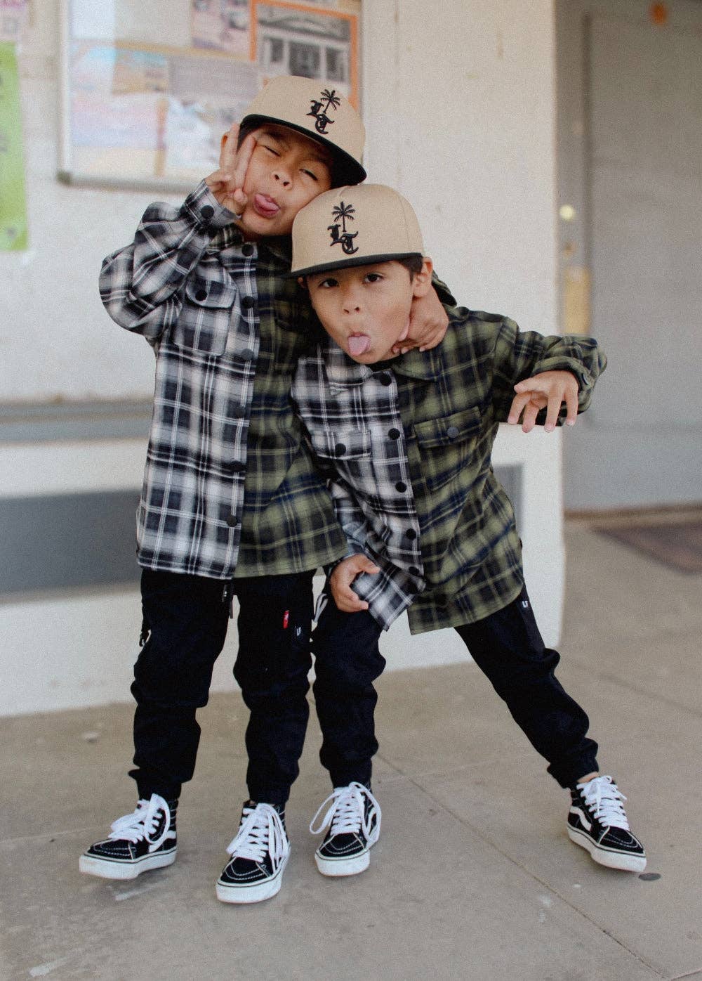 Kids black cargo jogger pants with custom LT hardware and rubber keychain detail side view
