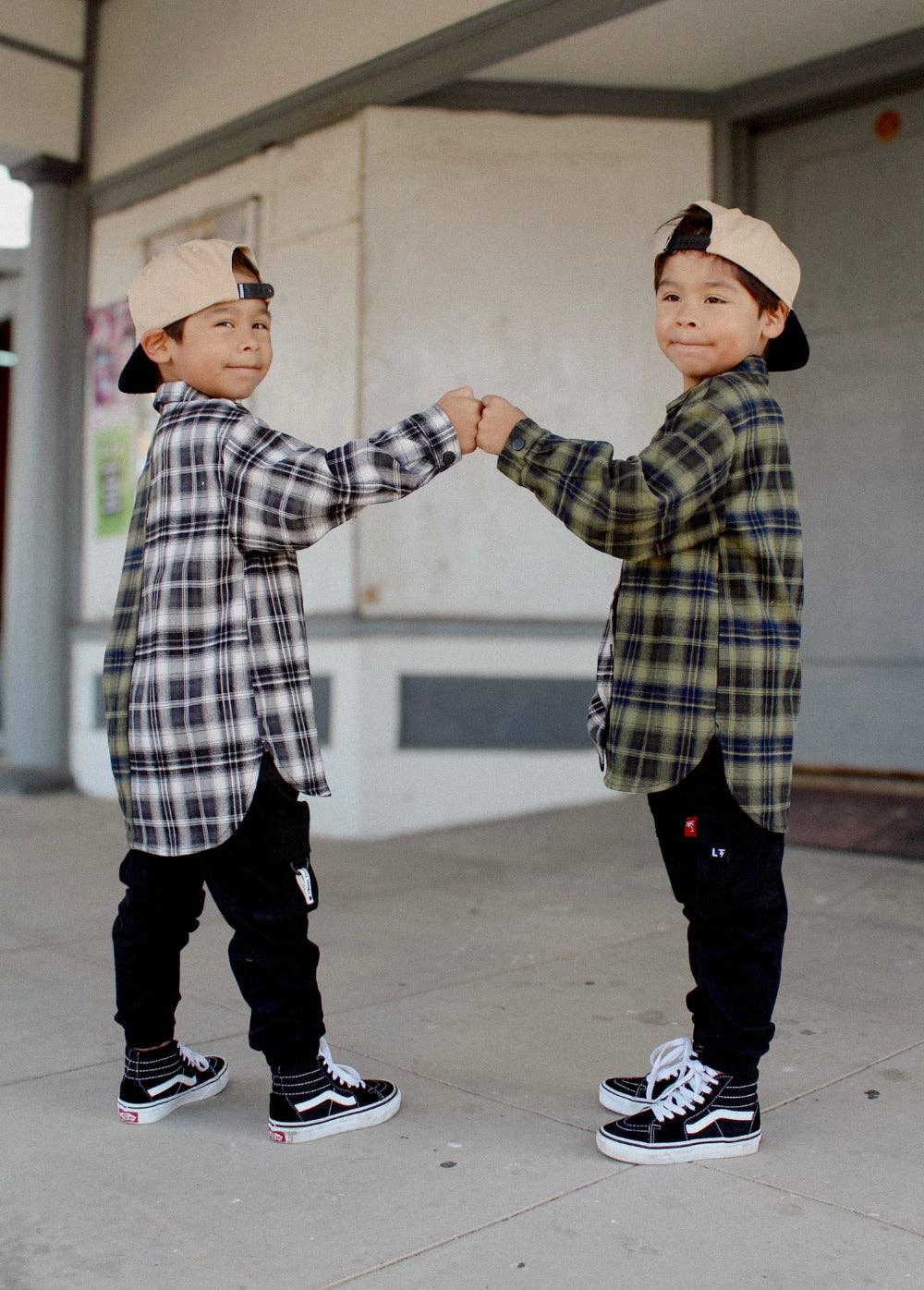 Boys black cargo jogger pants with elastic drawstring waistband back view