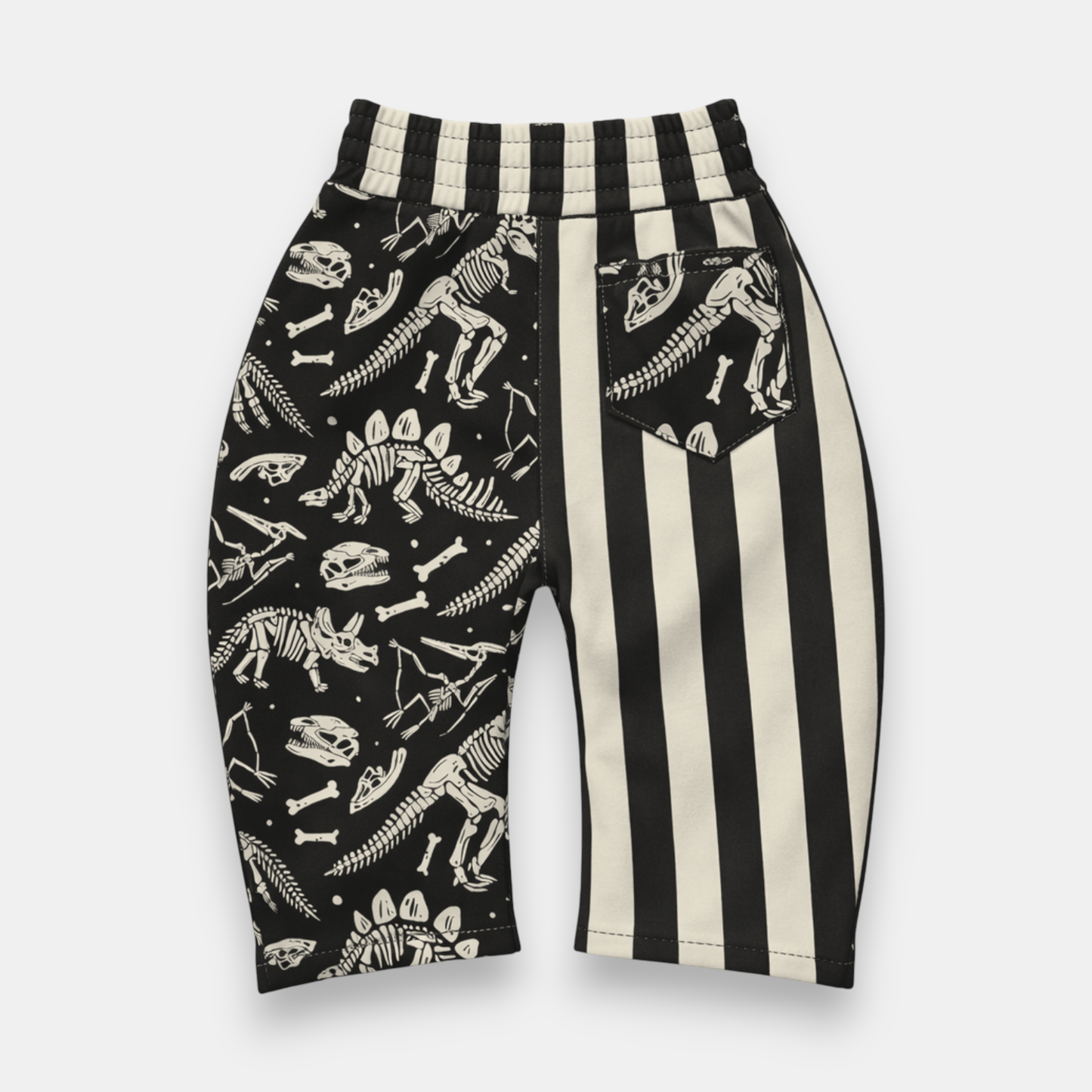 Kids relaxed fit fossil print pants with pull-on waistband and front pockets detail view