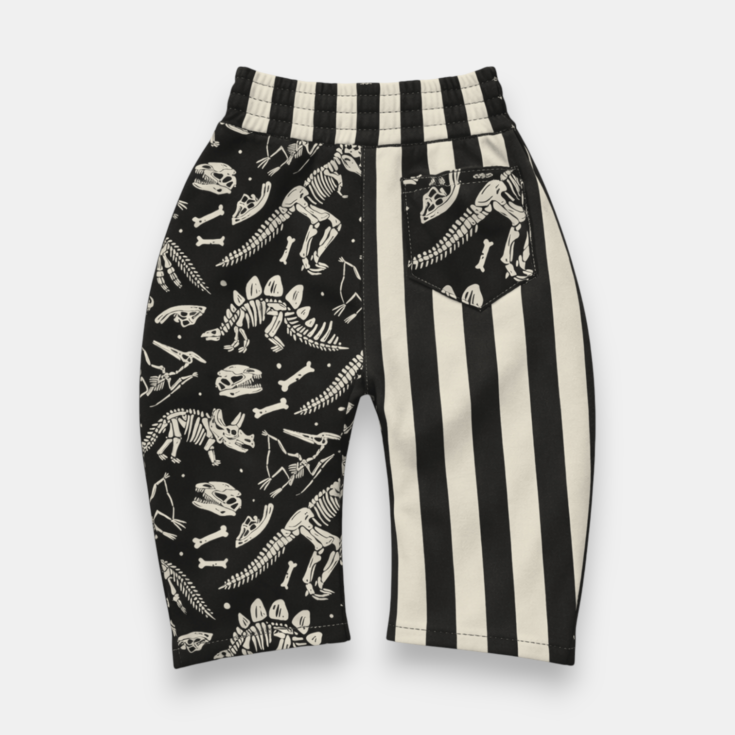 Kids relaxed fit fossil print pants with pull-on waistband and front pockets detail view